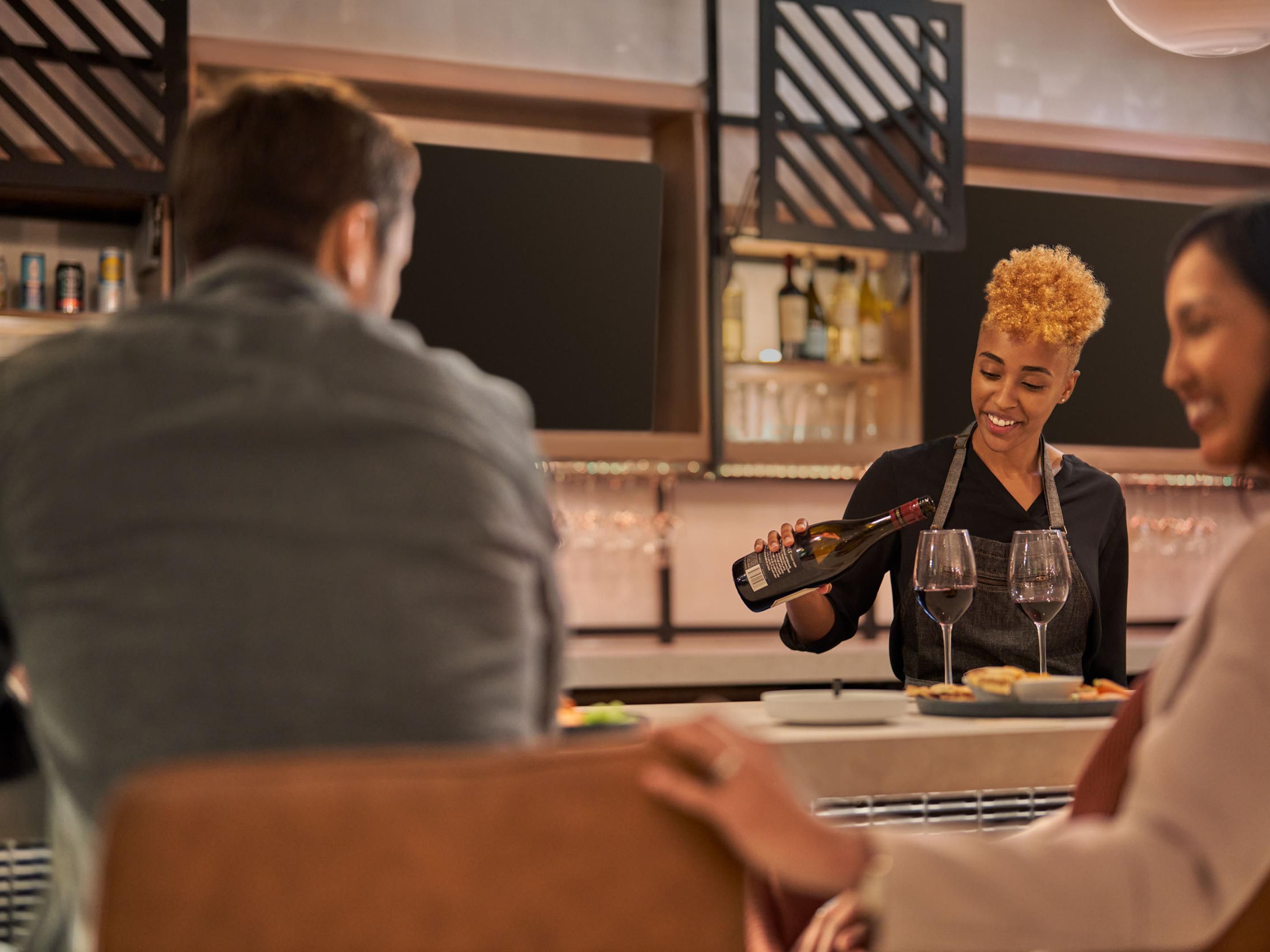 Bartender serving up cocktails