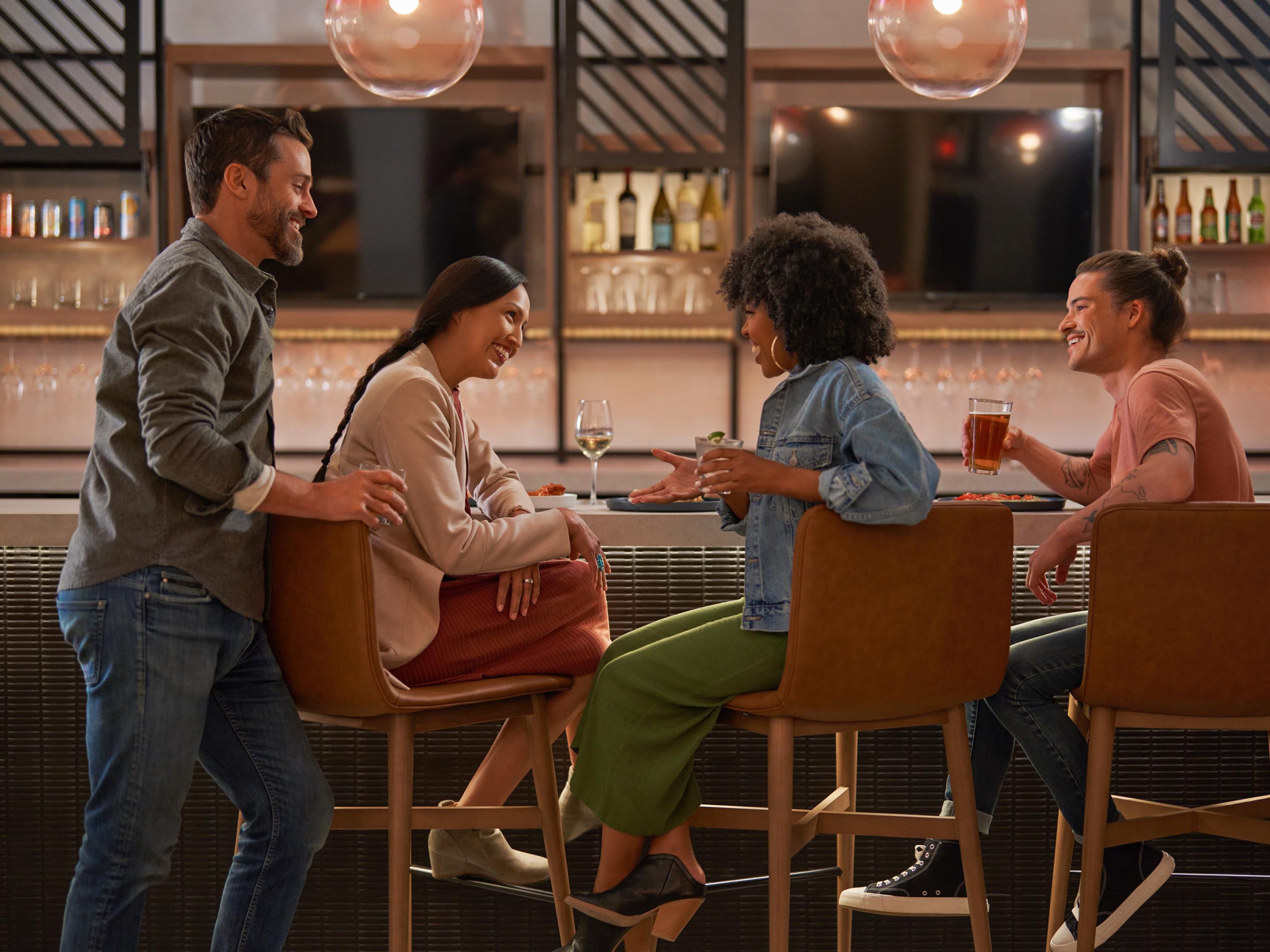 Friends enjoying drinks at the Legacy Bar