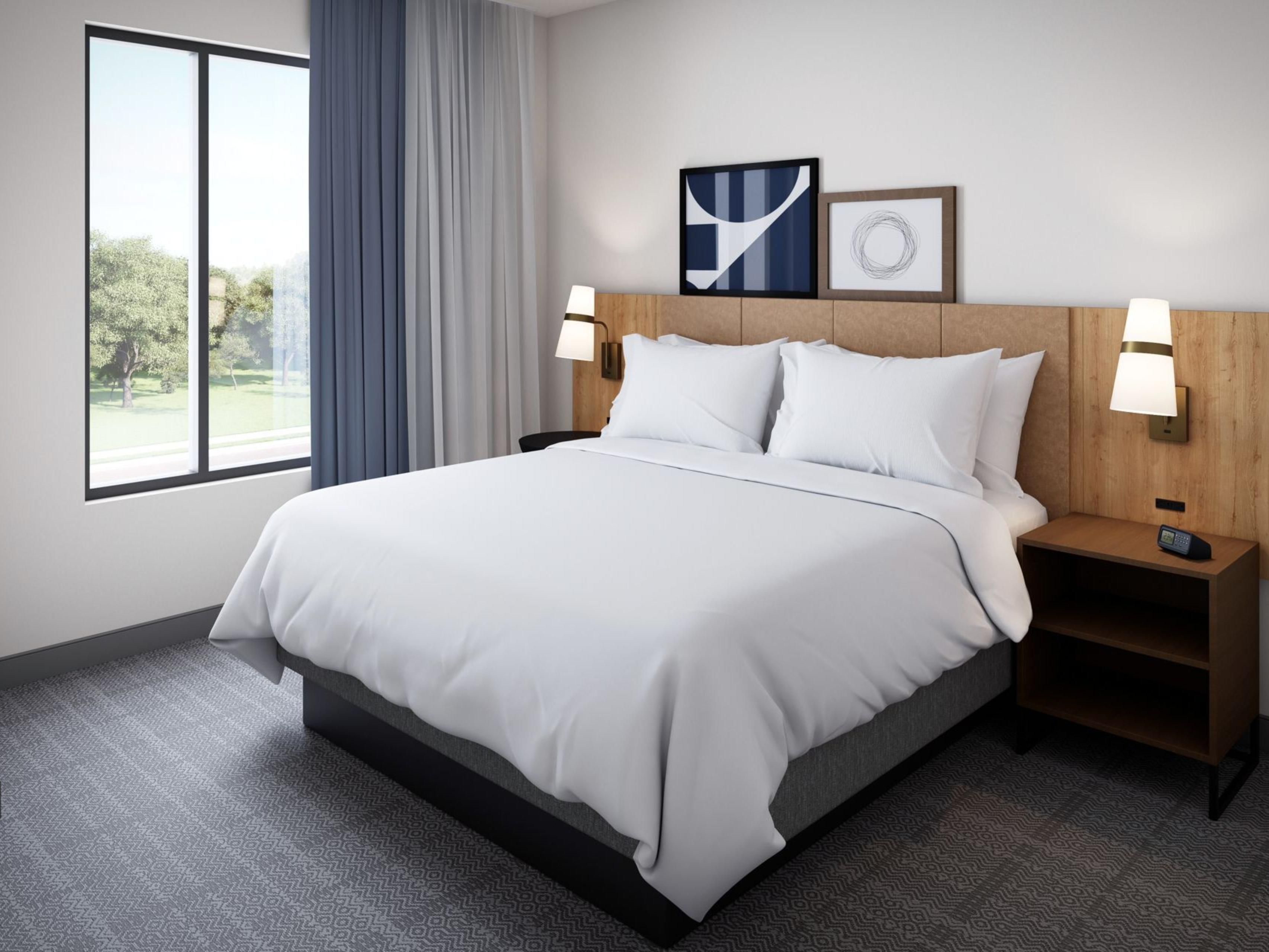 Bed in a bedroom with a view outside