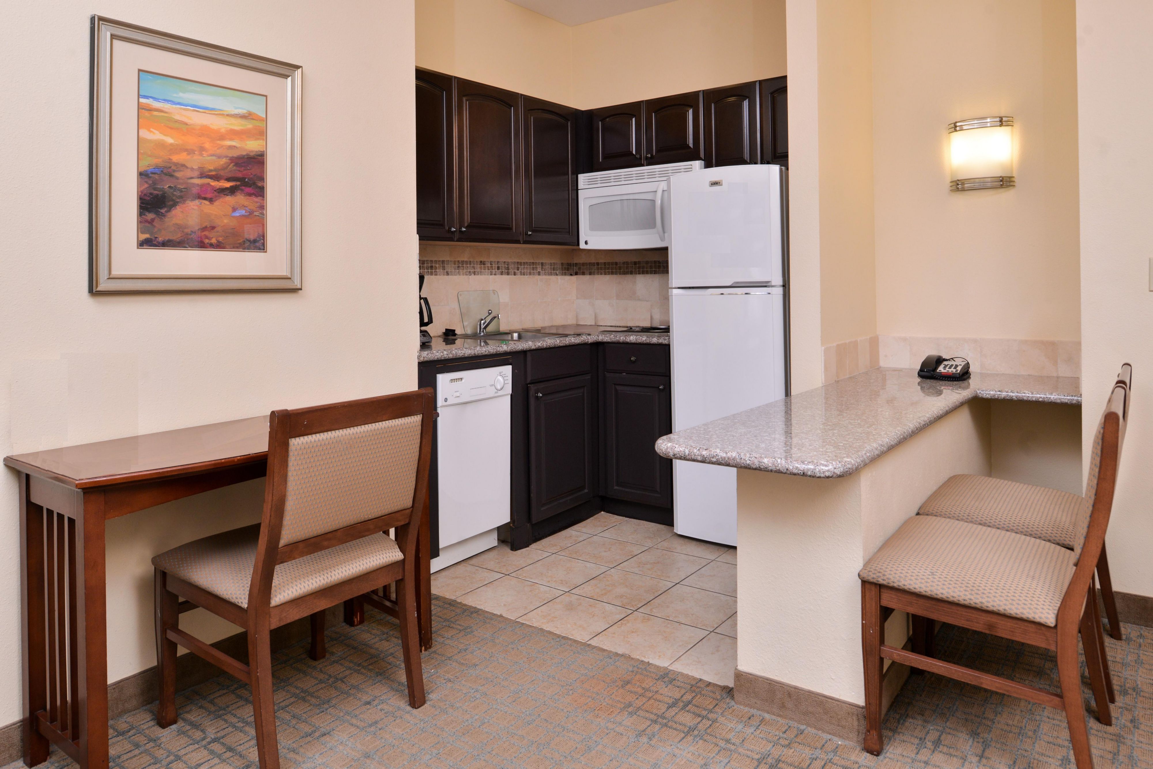 Enjoy all the comforts of home in our apartment-style suites with full kitchens. You'll have everything you need to make a great meal on the road with the ensuite stove, microwave oven, refrigerator, and cooking utensils.