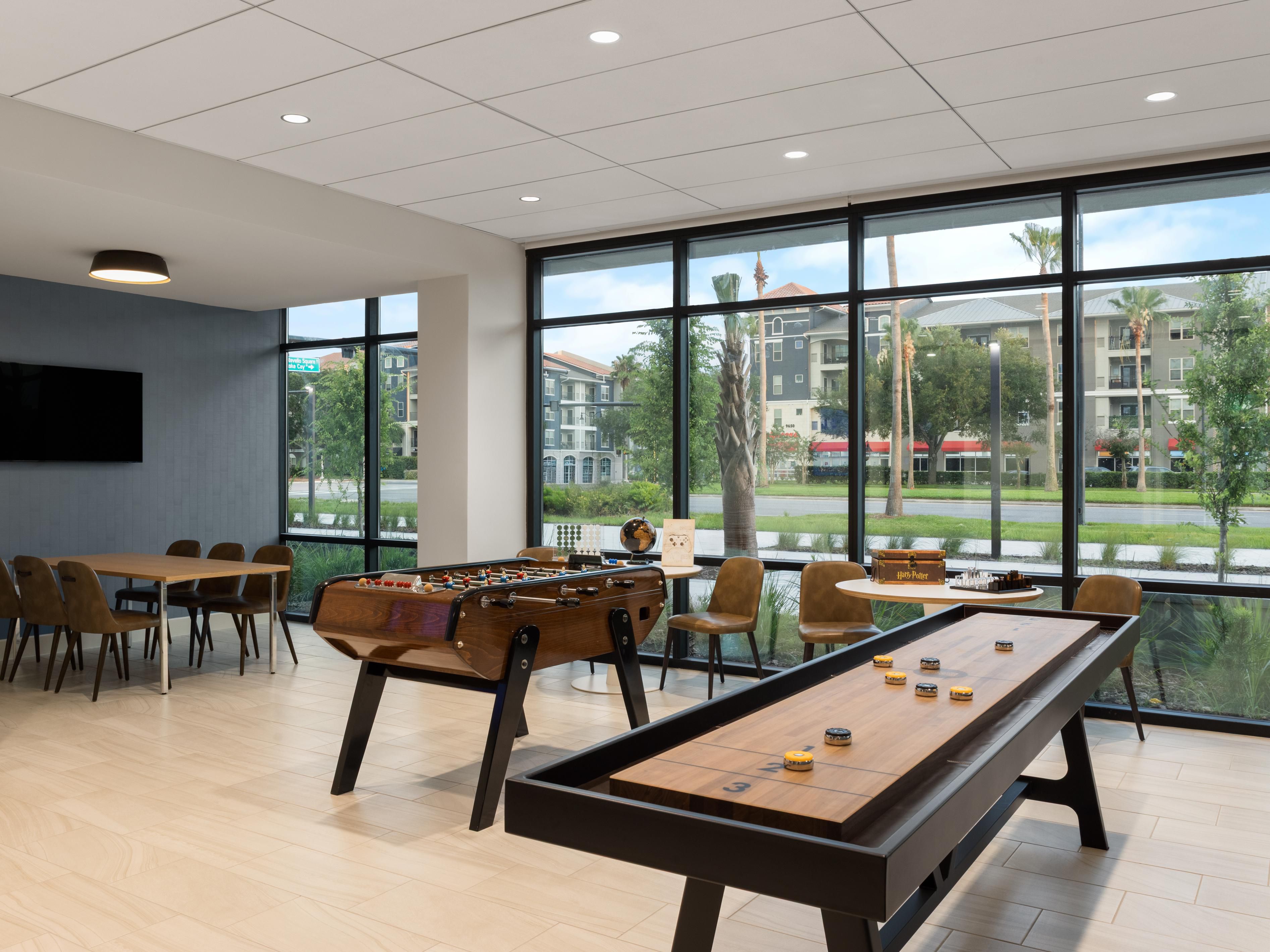 Game room with shuffleboard and foosball