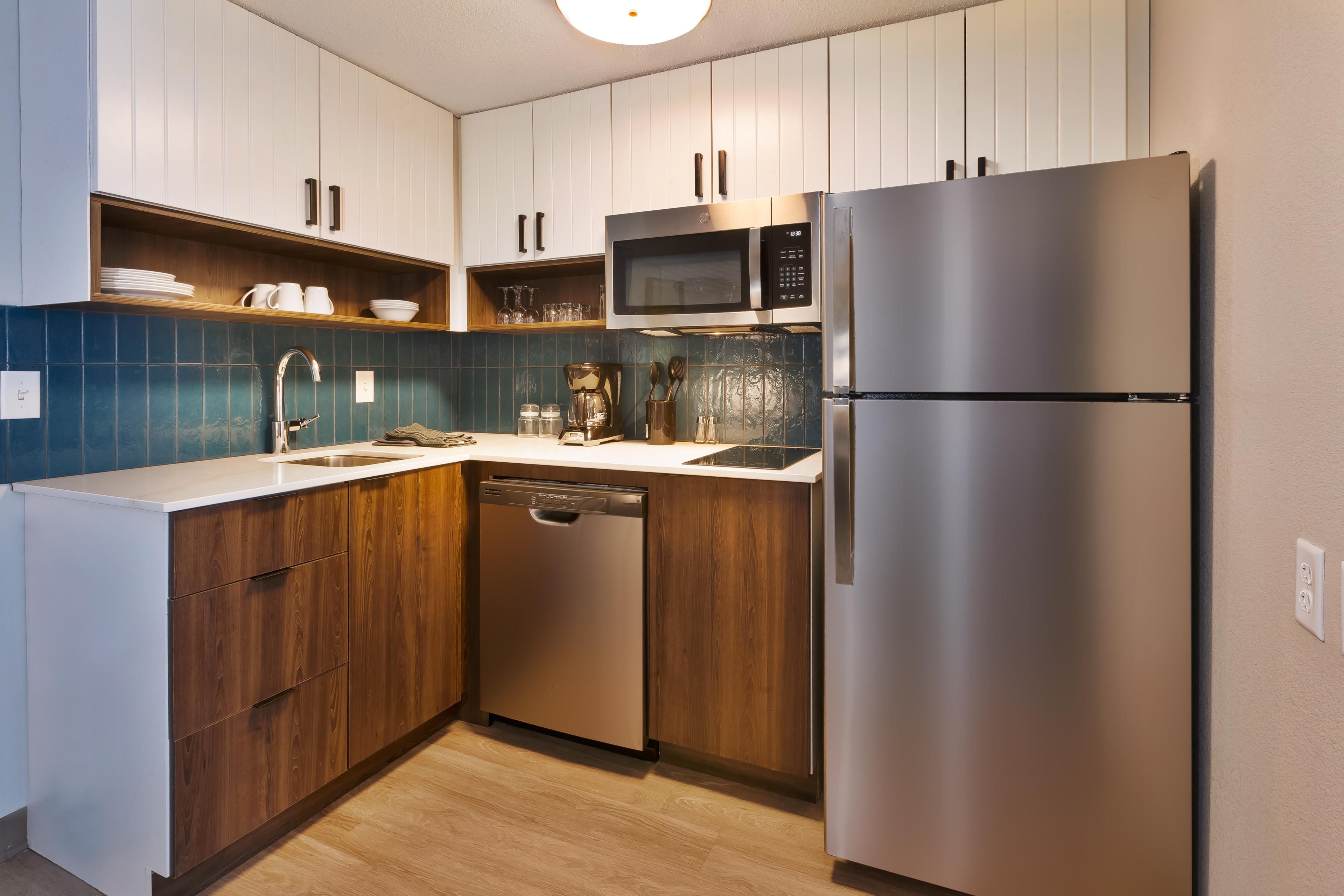 Enjoy the convenience of a fully equipped kitchen in every suite, complete with a stovetop, microwave, refrigerator, and all the cooking essentials. Cook your favorite meals and feel right at home during your stay.