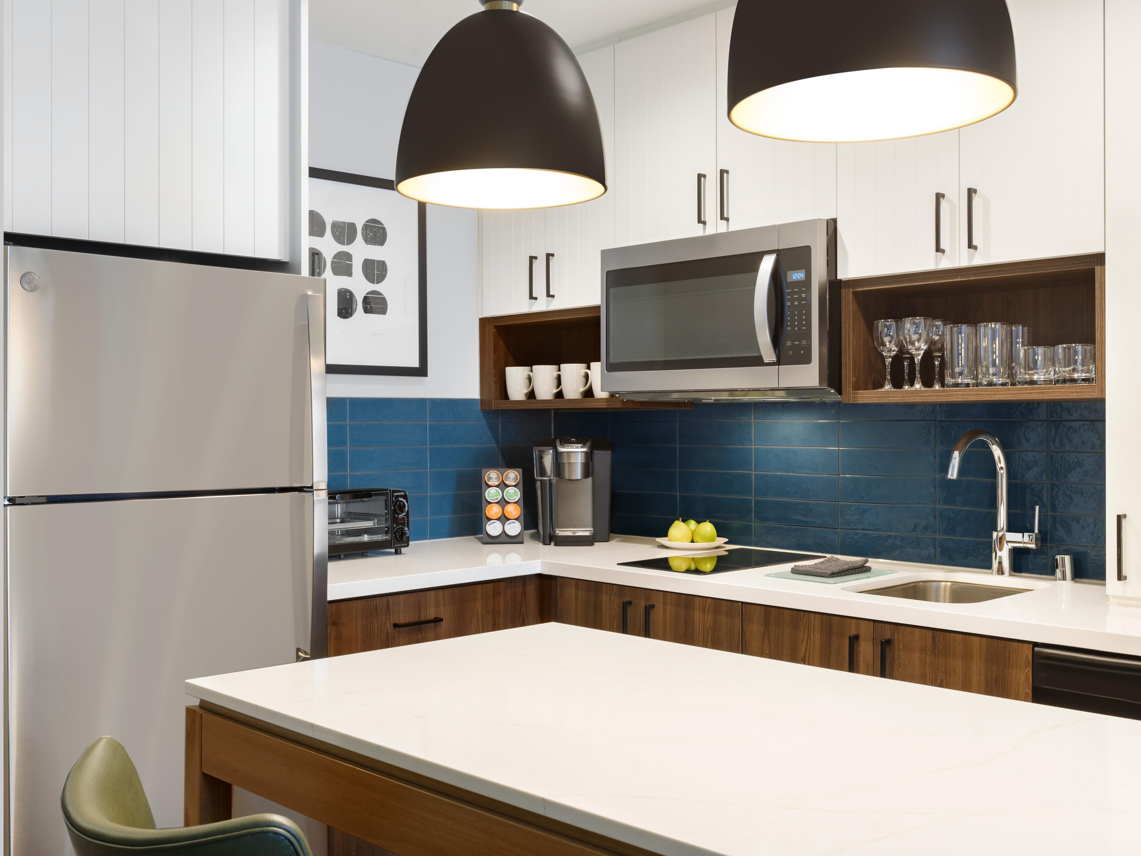 In-room kitchen area with microwave and refrigerator