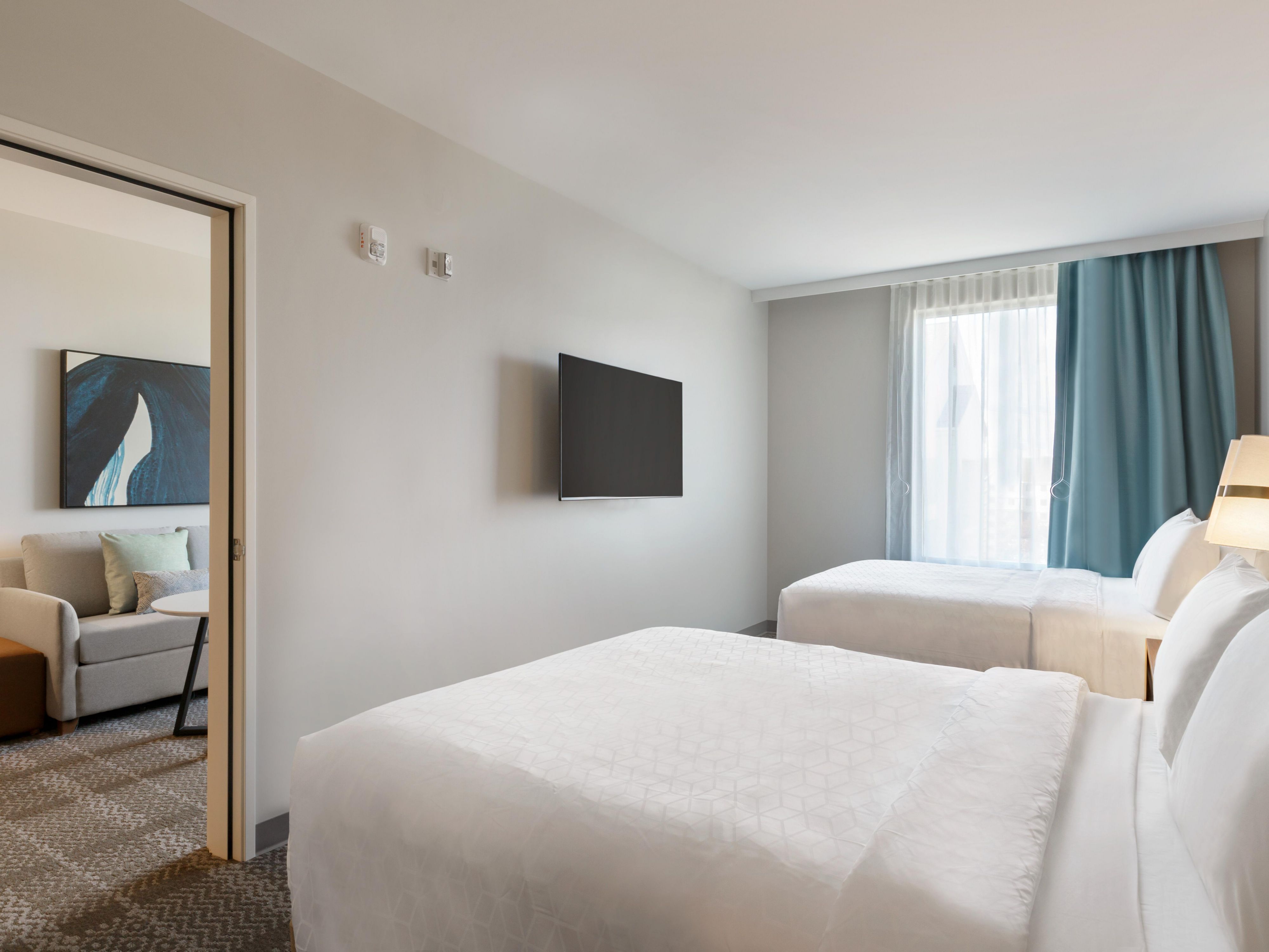 Two queen beds in a bedroom