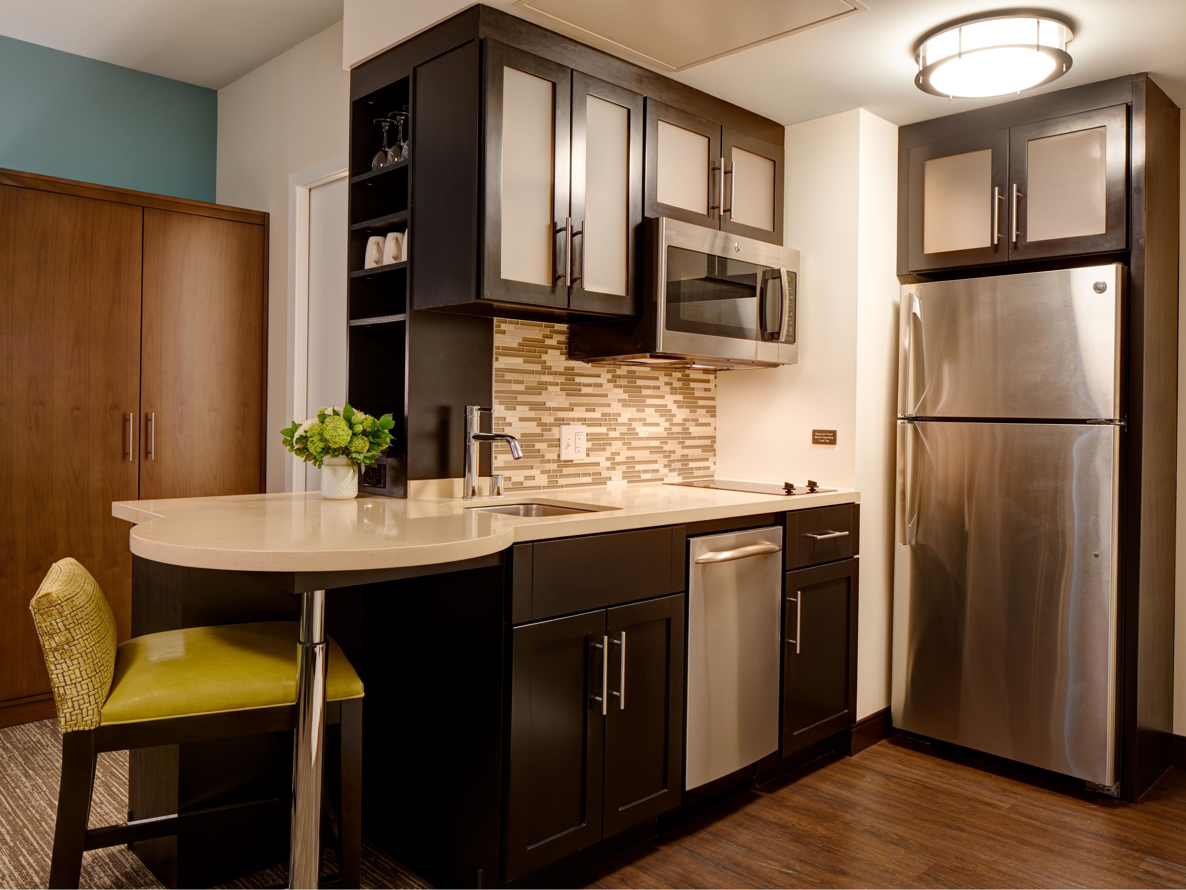 In-room kitchen area with microwave and refrigerator