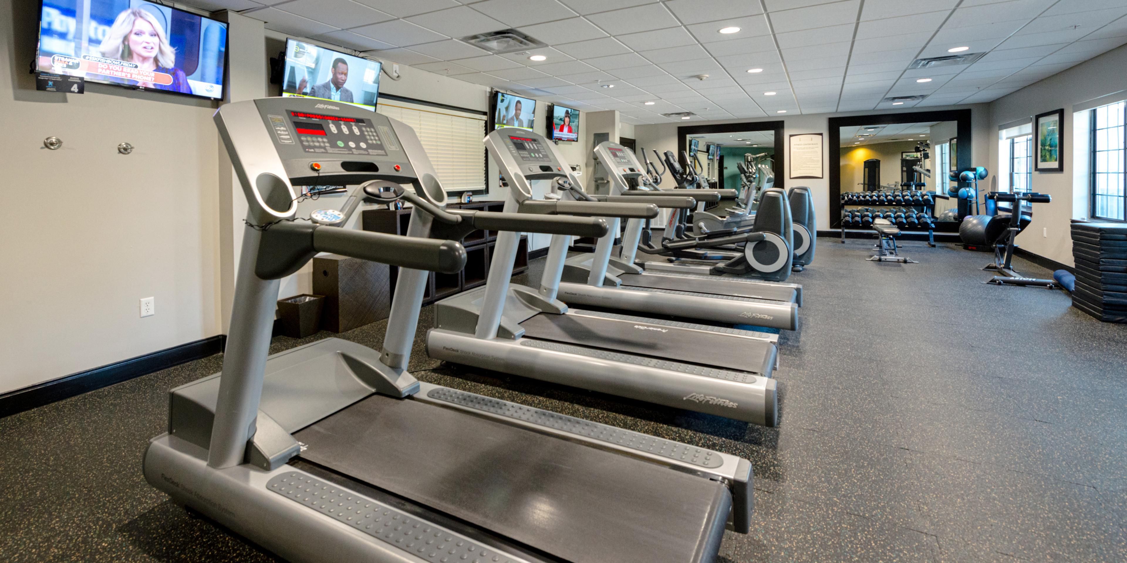 1100 sq ft fitness center with cardio and free weights.