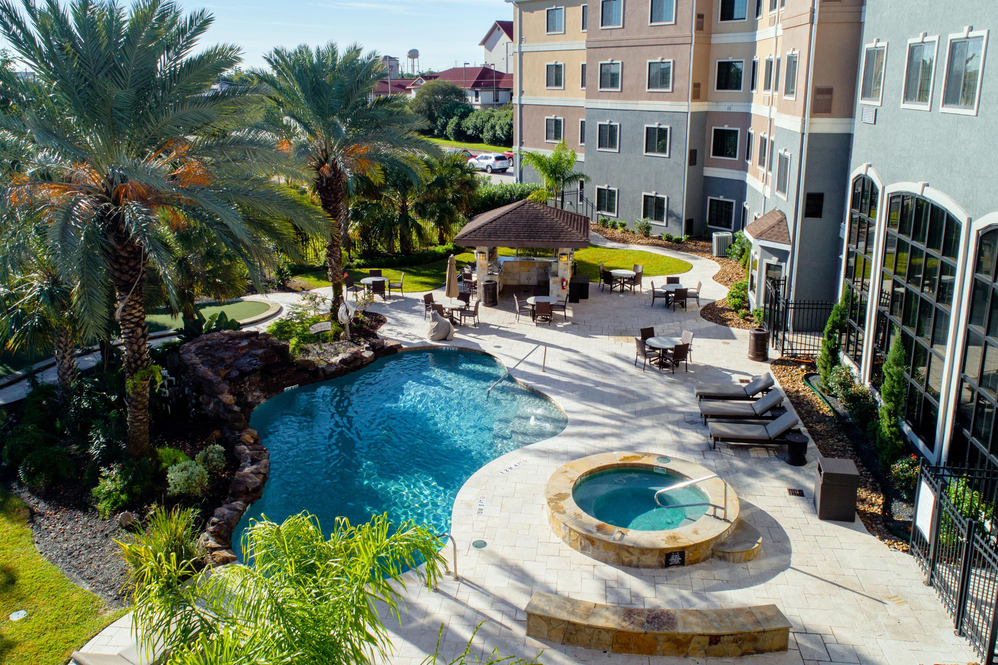 Relax and unwind after a long day in our beautiful outdoor space, featuring a resort-style pool and hot tub. Fire up one of the two stainless steel grills under the shaded gazebo, perfect for casual cookouts. or a bit of fun, enjoy yard games like giant chess and more—ideal for both relaxation and play. Pickleball Court Coming Soon!
