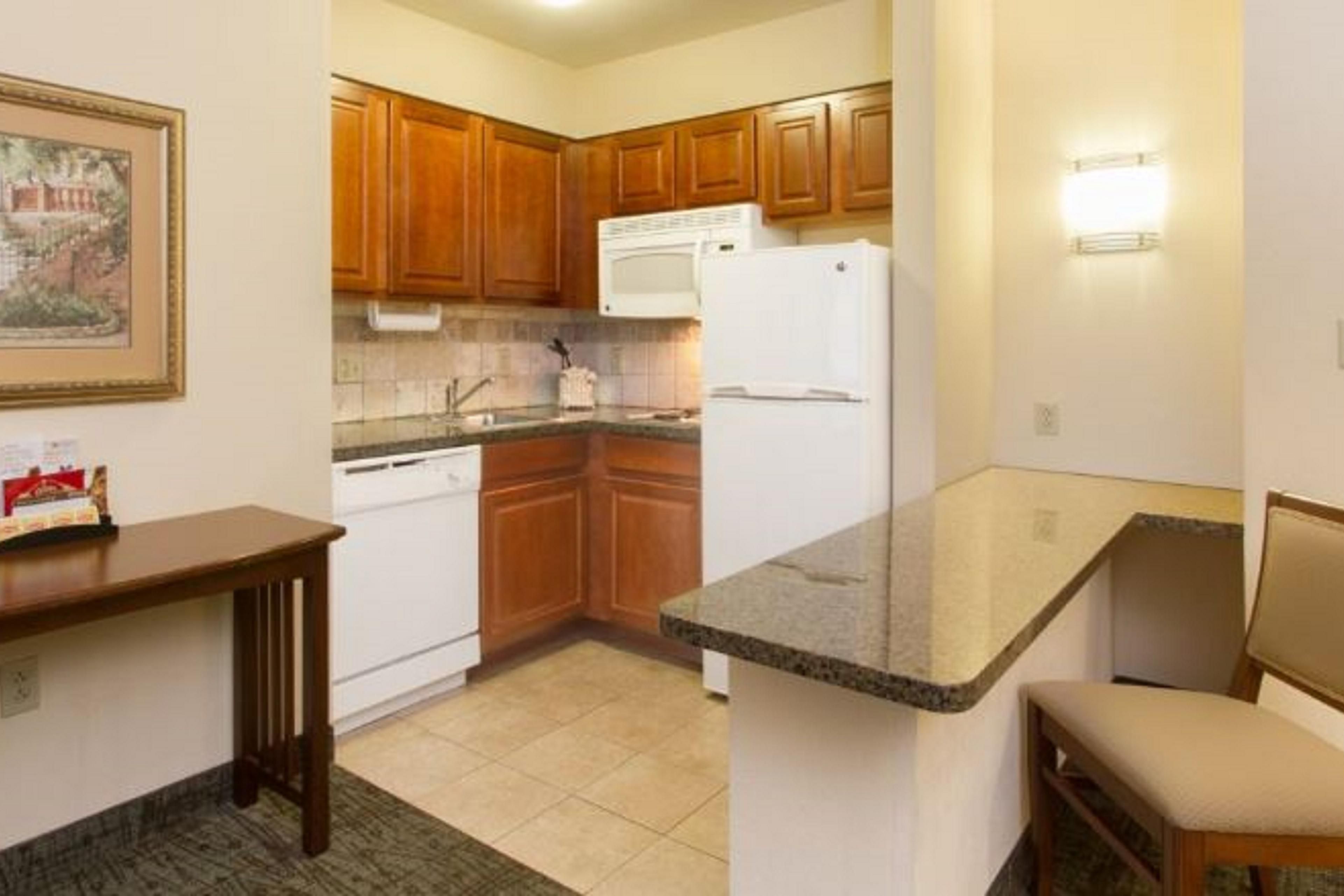 Our all-suite hotel comes with extra square footage and a fully equipped kitchen in every room. Kitchens include a stovetop, full-size fridge, microwave, dishwasher, sink with the garbage disposal, cookware, dinnerware and serve ware.
