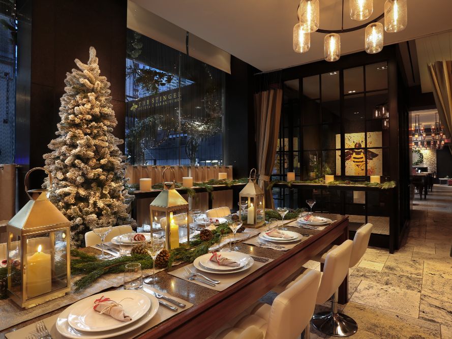 Stinger restaurant with long table and Christmas tree