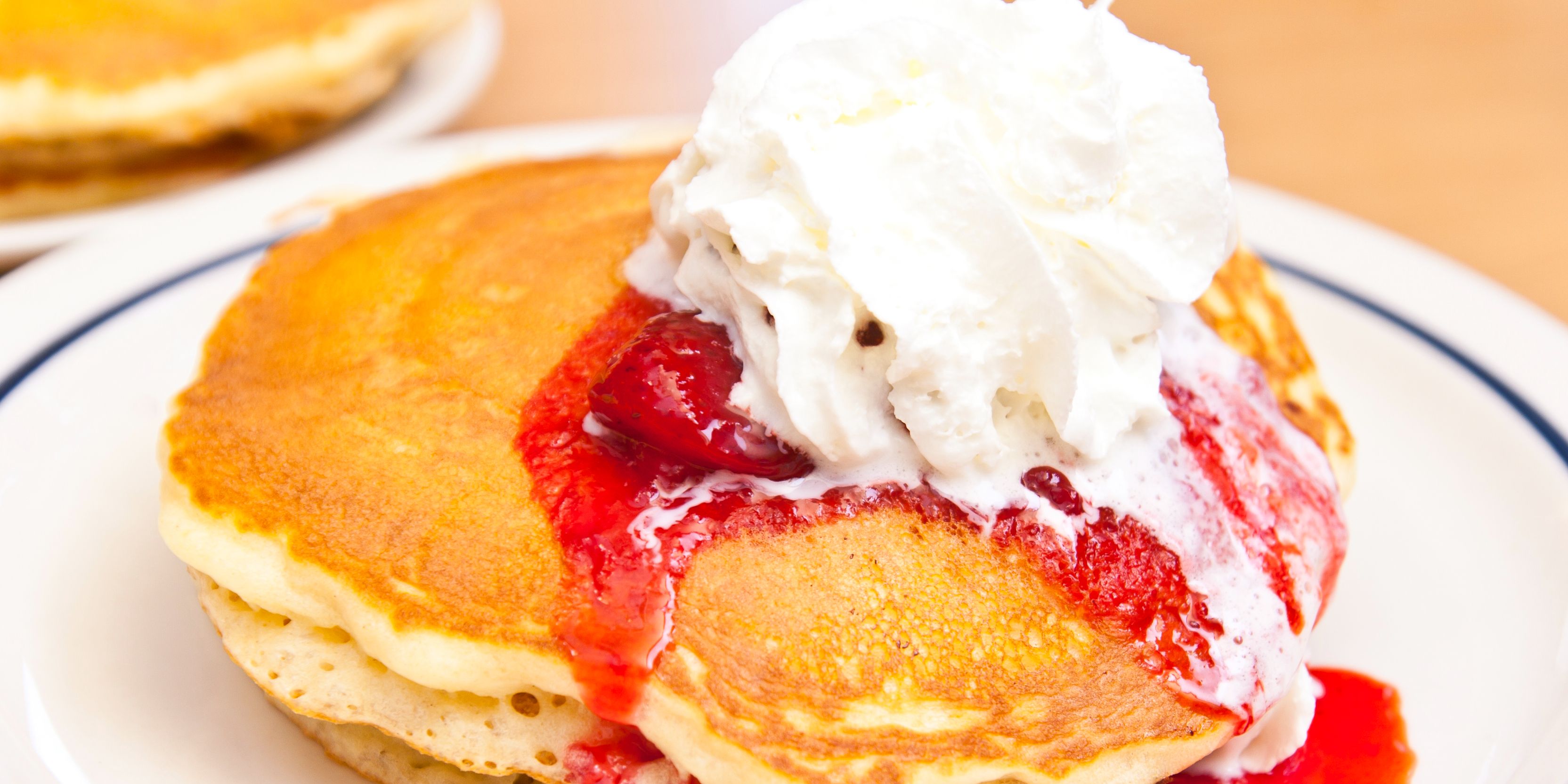 Pancakes with straberries and whipped cream