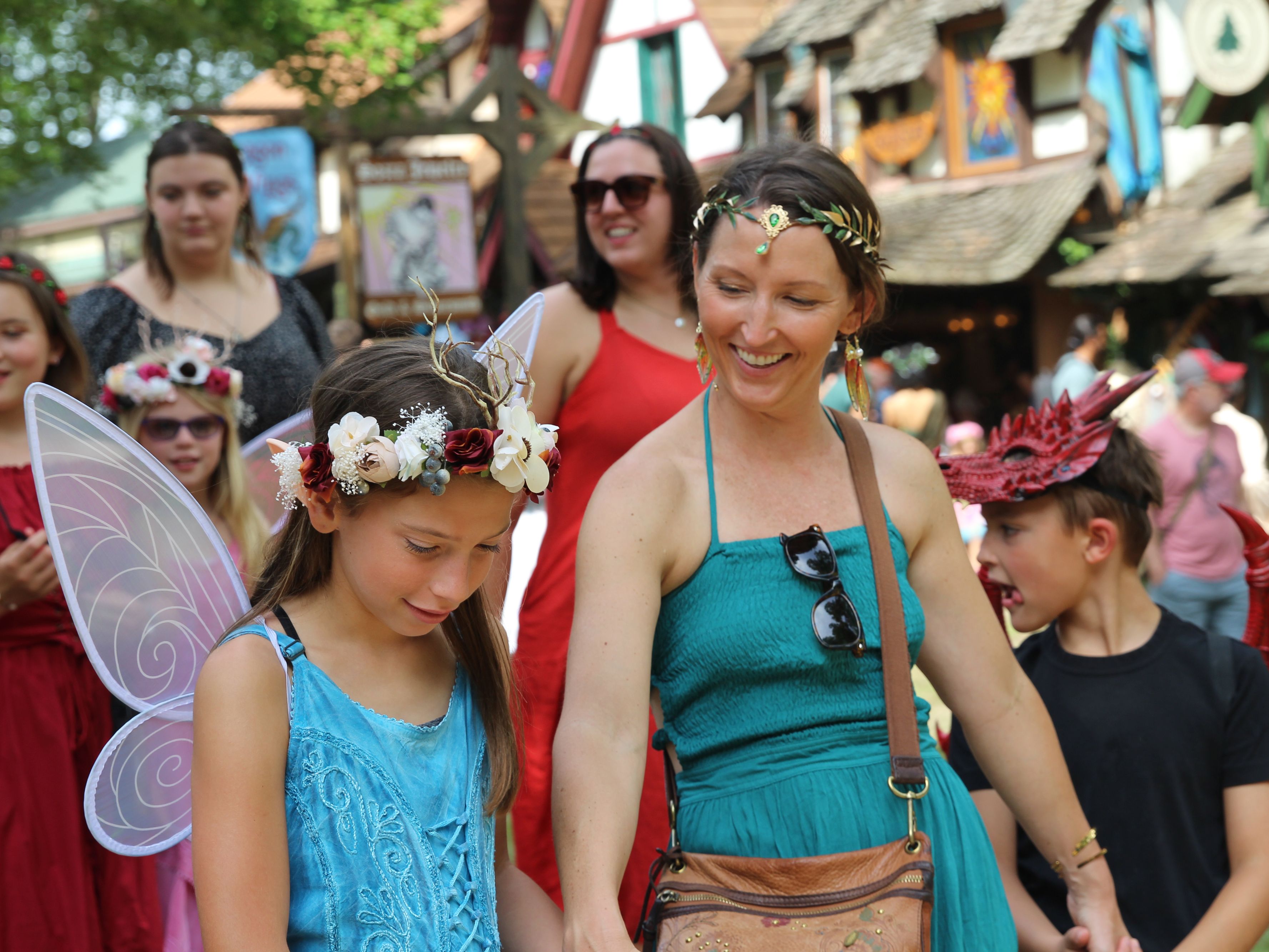 mom and daughter dressed up as fairies at festival