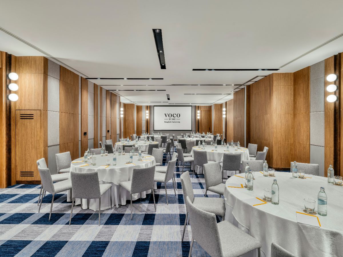 Banquet-style event space with round table seating.