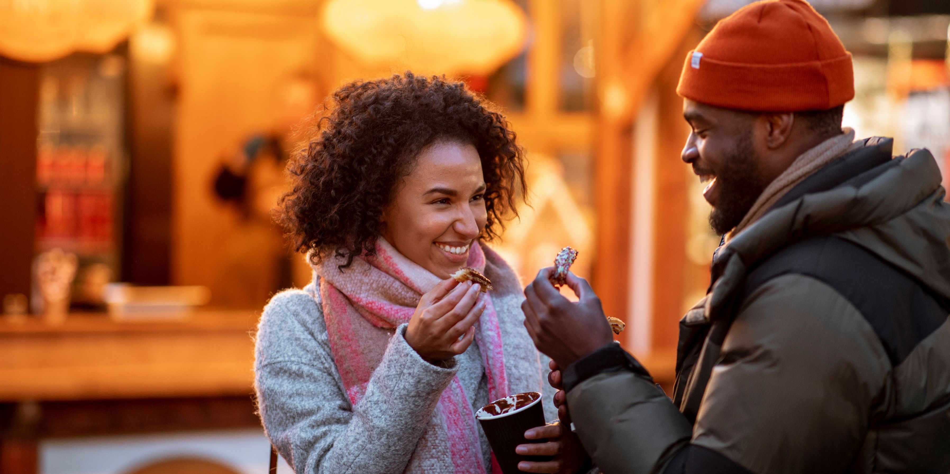 Couple having sweet treats and cocoa