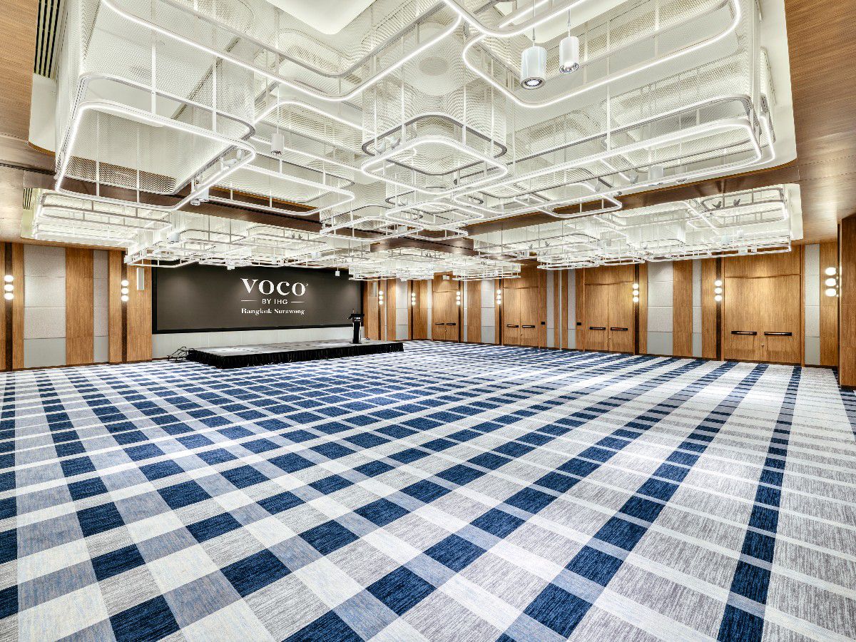 Spacious ballroom with modern lighting and an open event setup.