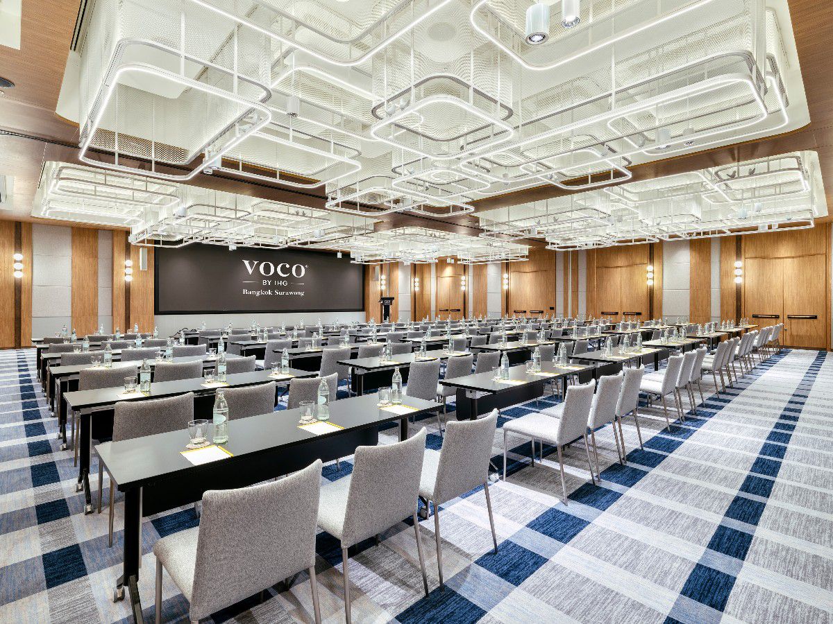 Meeting ballroom with conference-style seating and modern lighting.