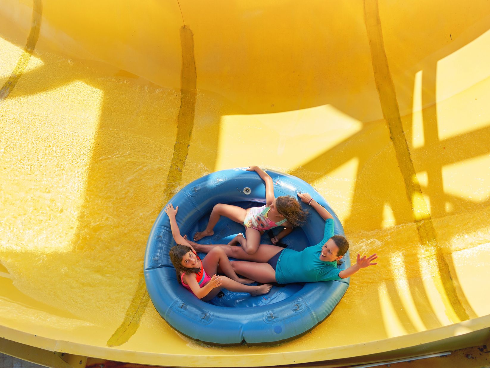 Tubing down a water slide