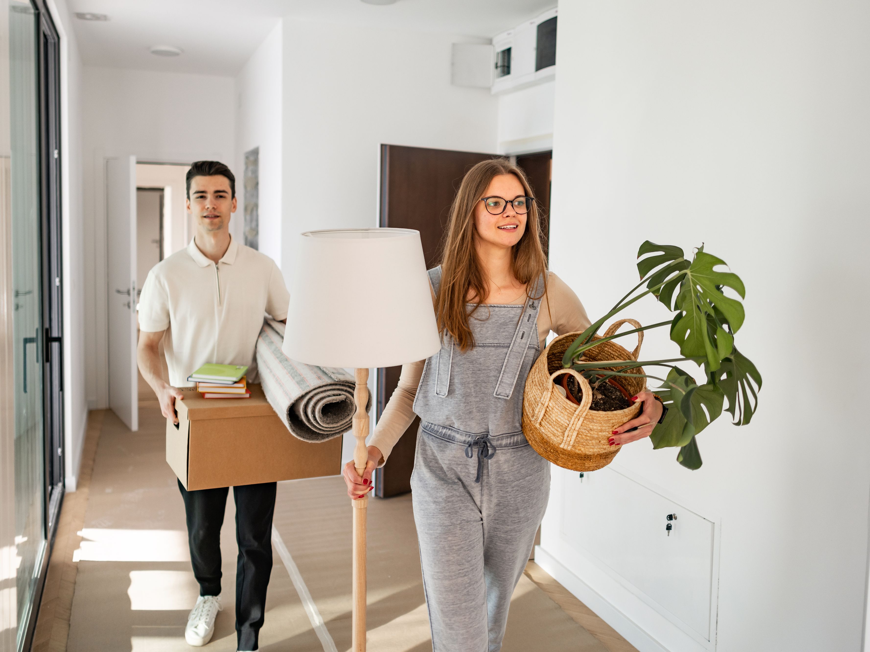 Two college students moving into dorms