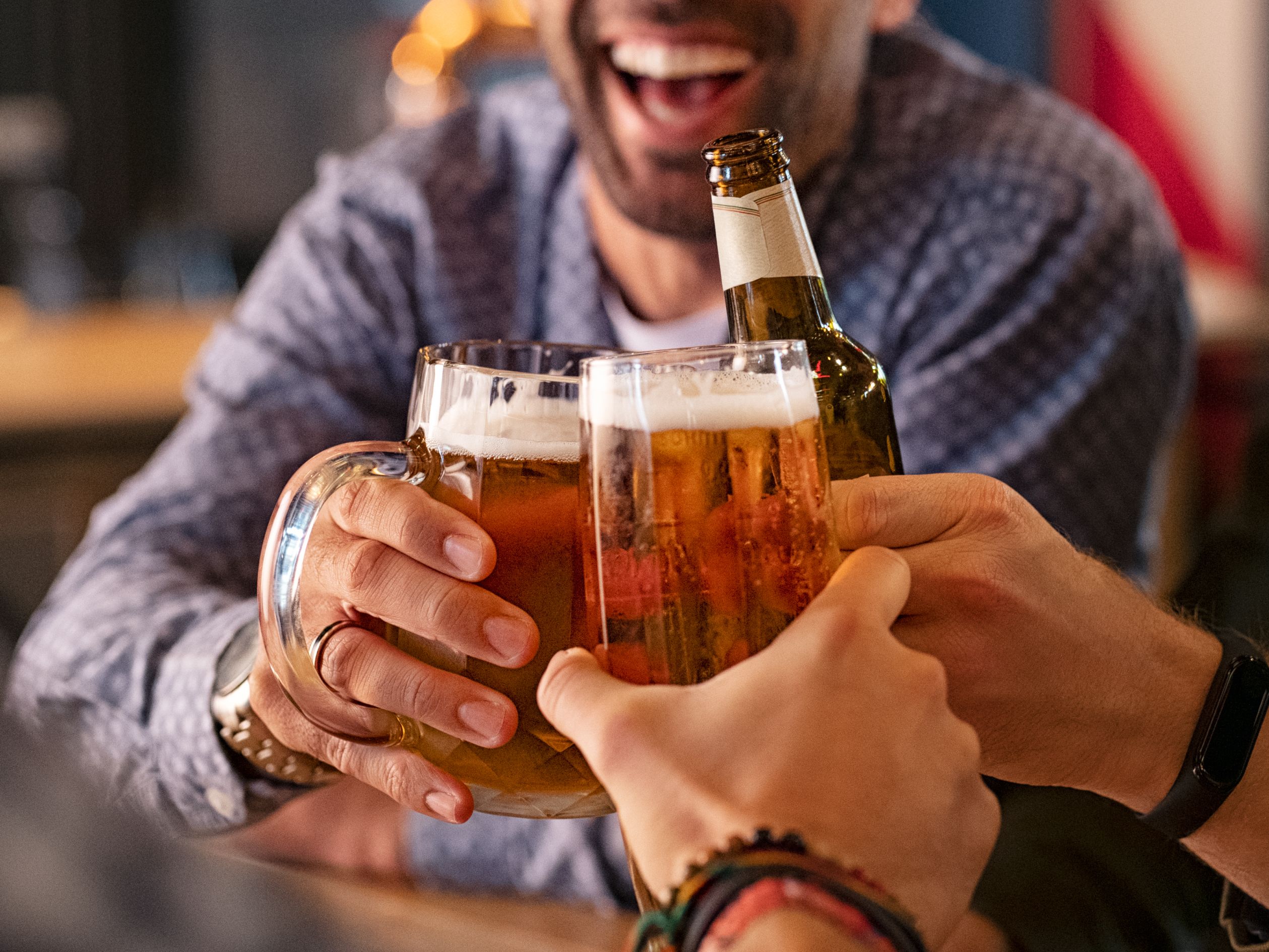 people cheersing with beer 