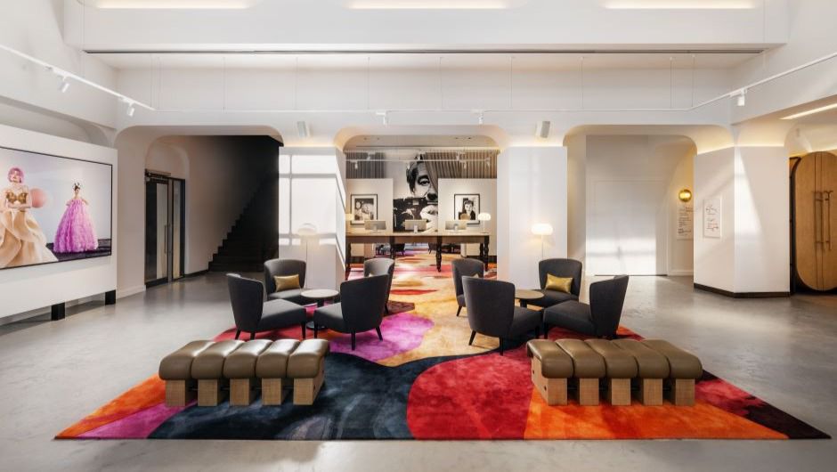 Sofas and chairs at the reception area of the lobby in Hotel Indigo Melbourne On Flinders 