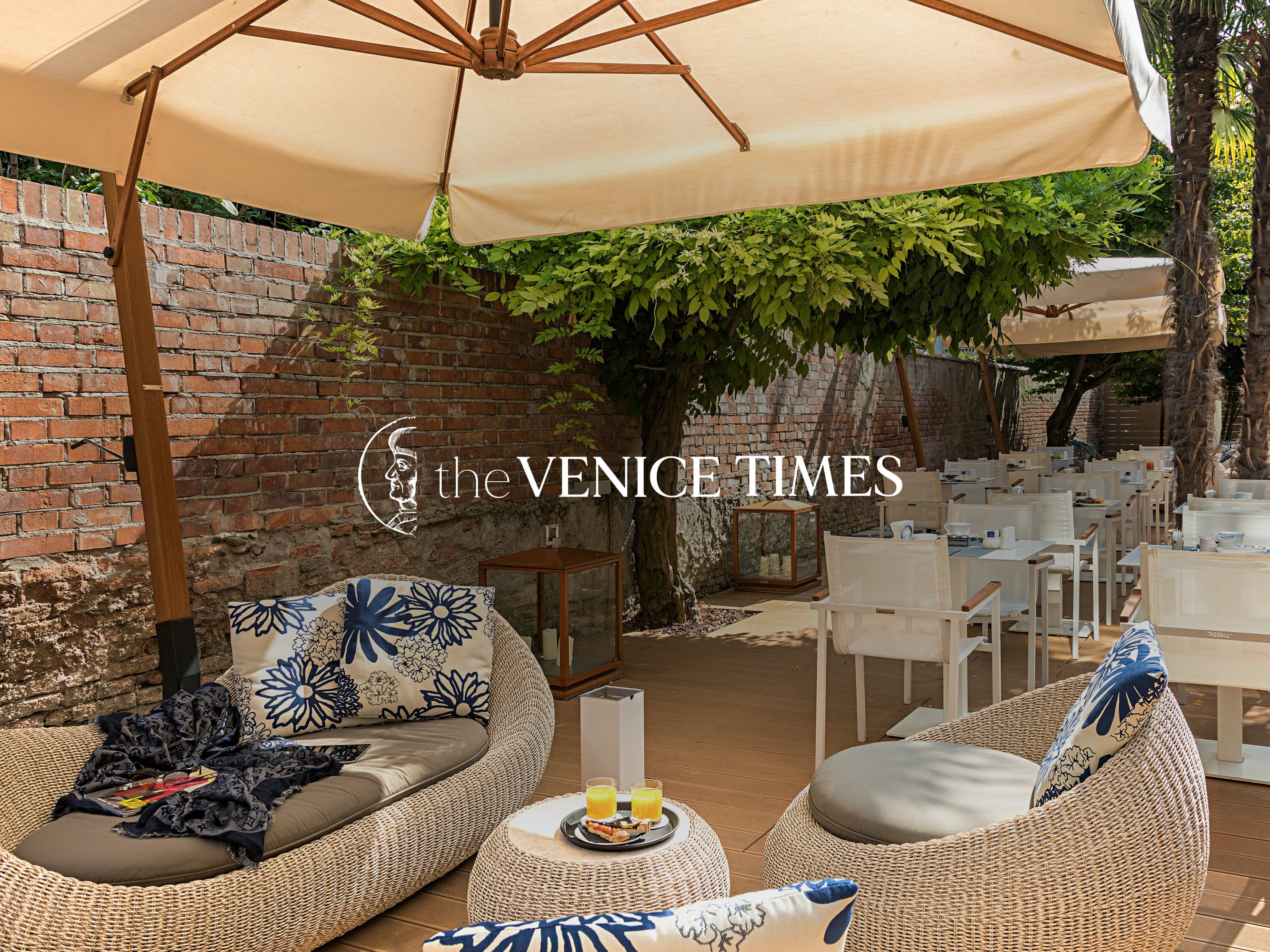 The Venice Times Hotel logo overlay.