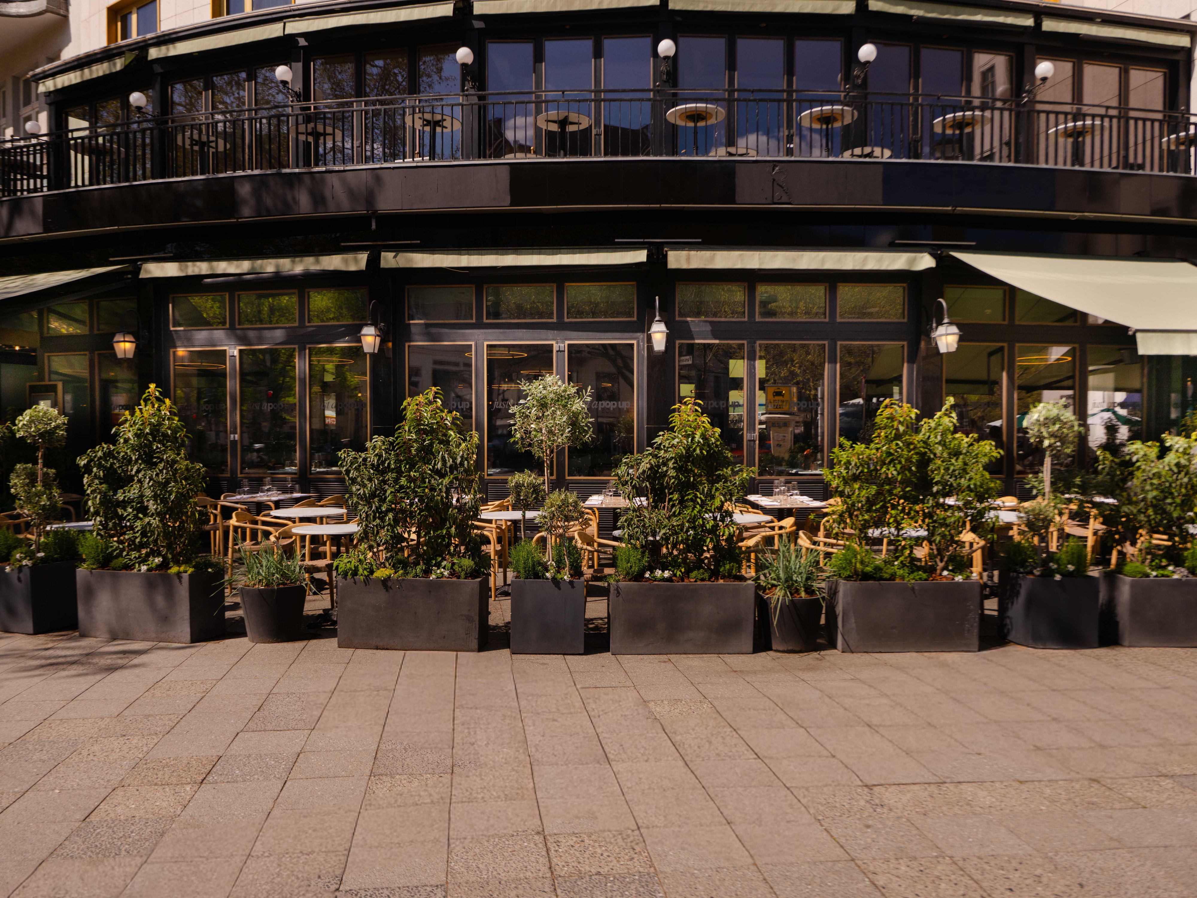 Outdoor terrace with greenery on Kurfürstendamm