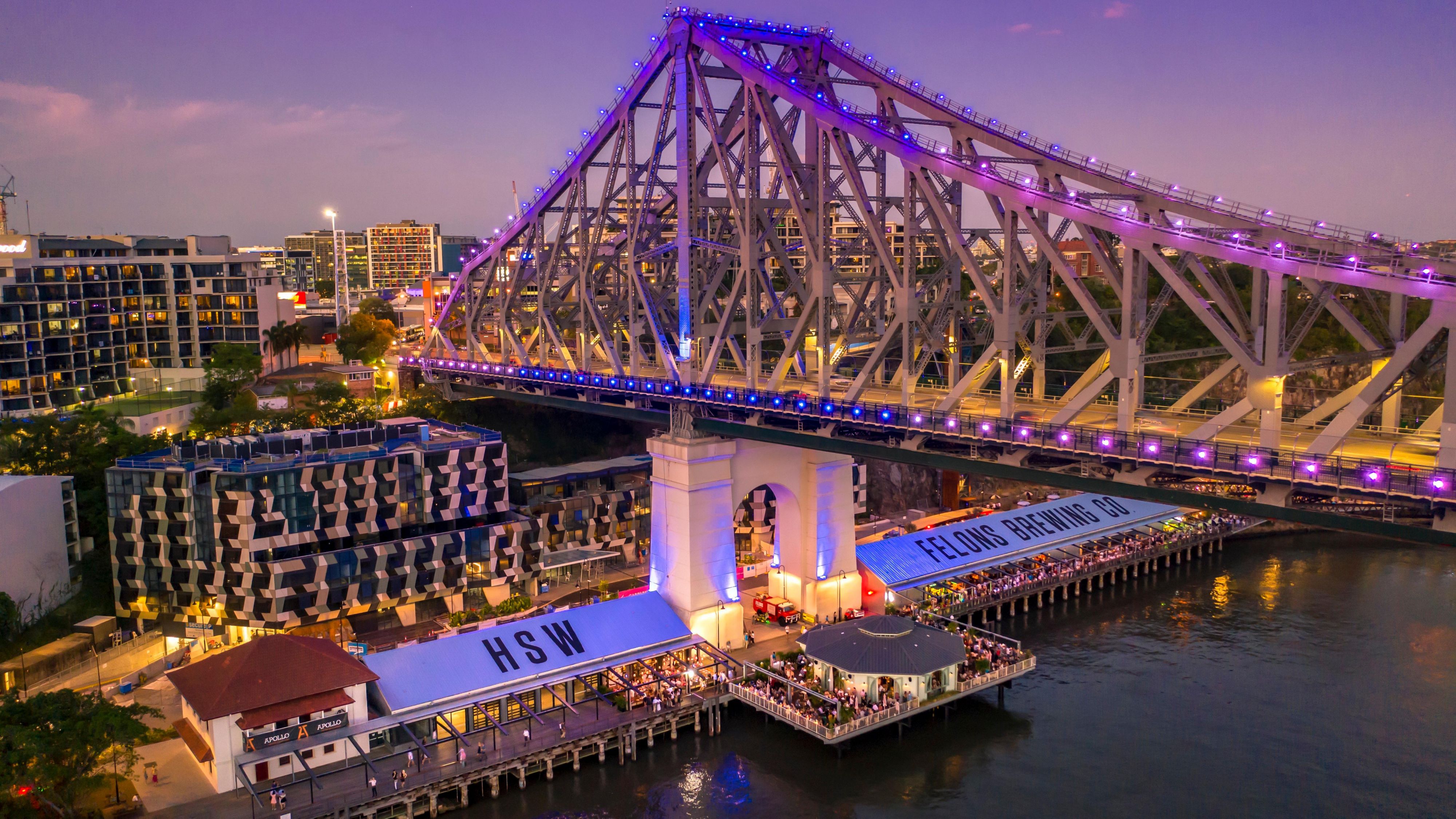 A vibrant city landmark illuminated against the evening skyline.