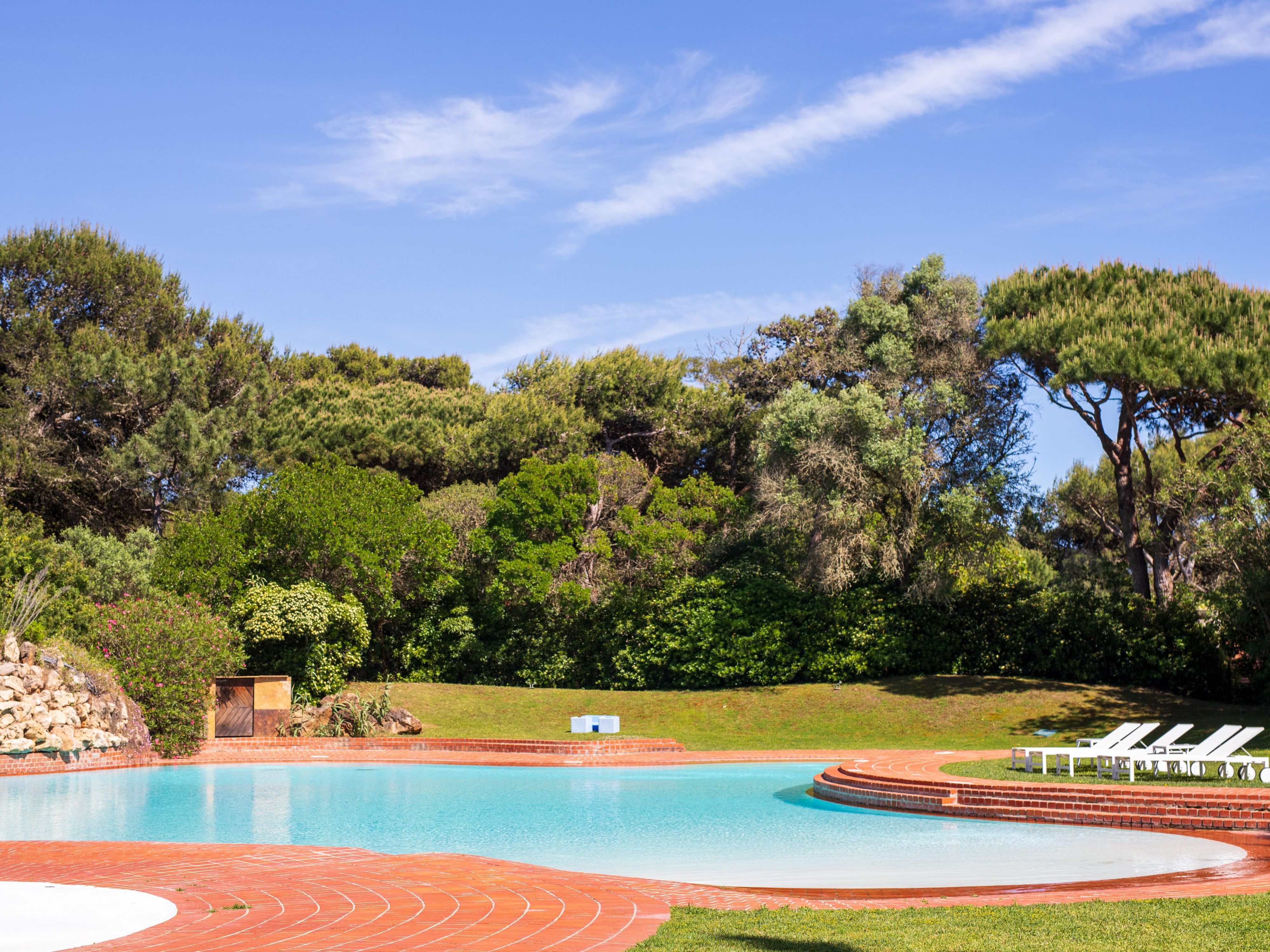 Experience poolside relaxation in Cascais, Portugal.