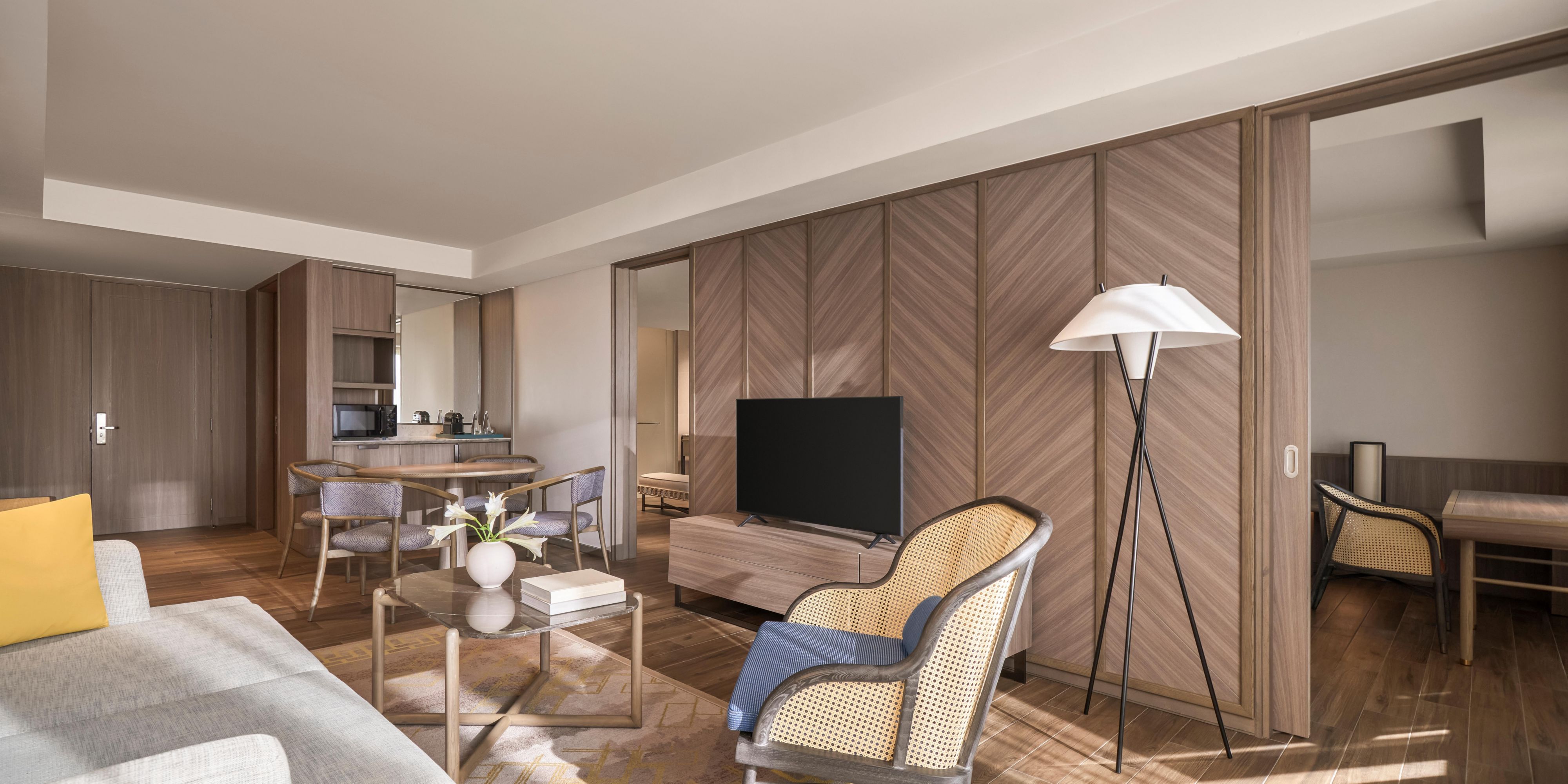 Spacious suite with warm tones and thoughtfully layered textures. 