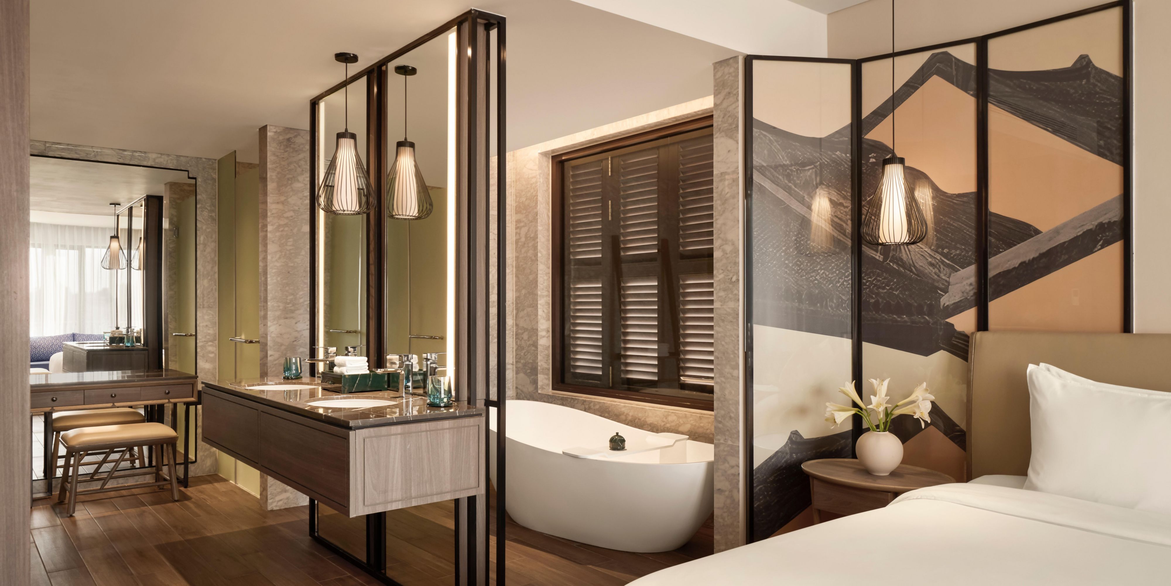 Villa bath area with soaking tub, twin vanities, and serene design