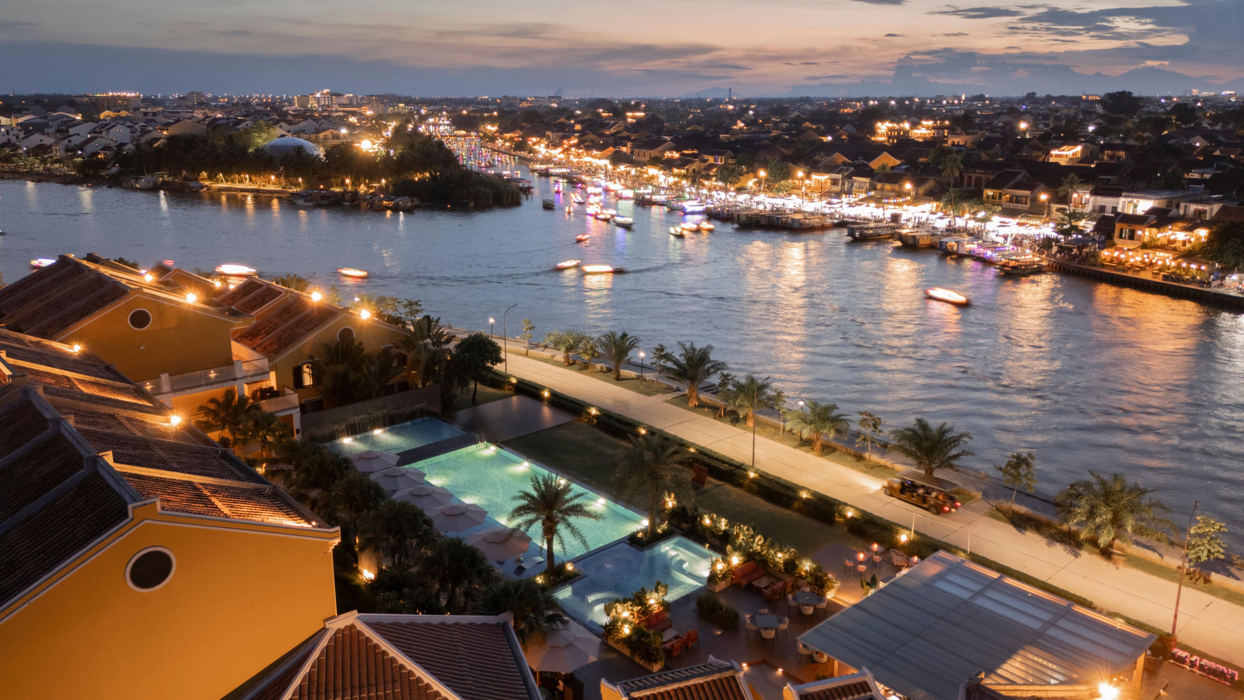 Soak in twilight magic with serene poolside views of Hoi An aglow.