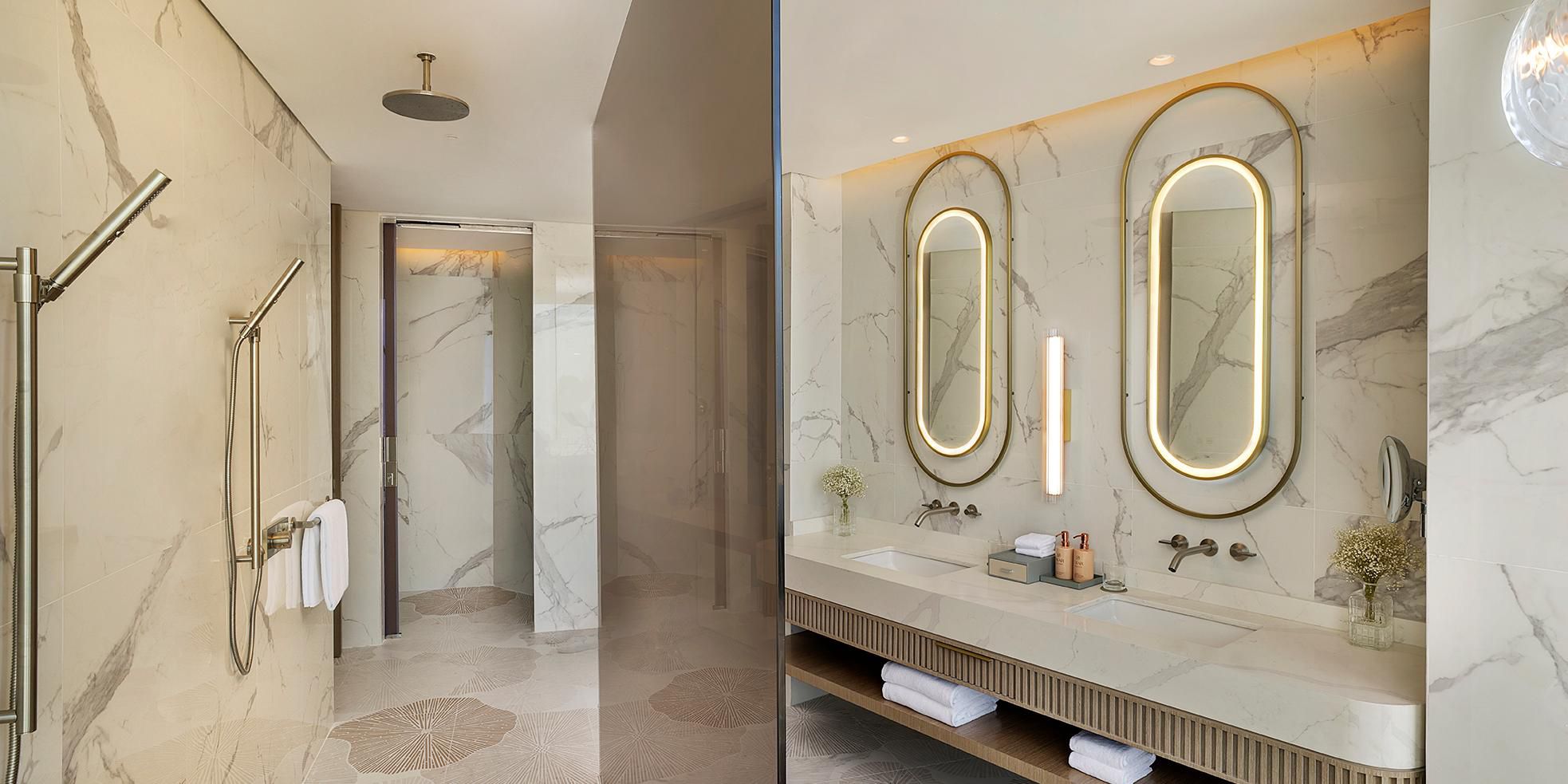 Open-plan bathroom with bathtub and seamless bedroom views