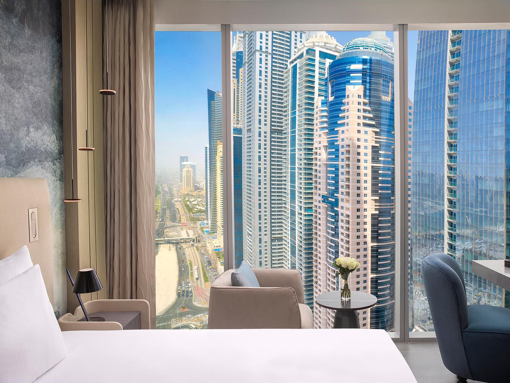 Elevated room opens to marina skyline glimpses