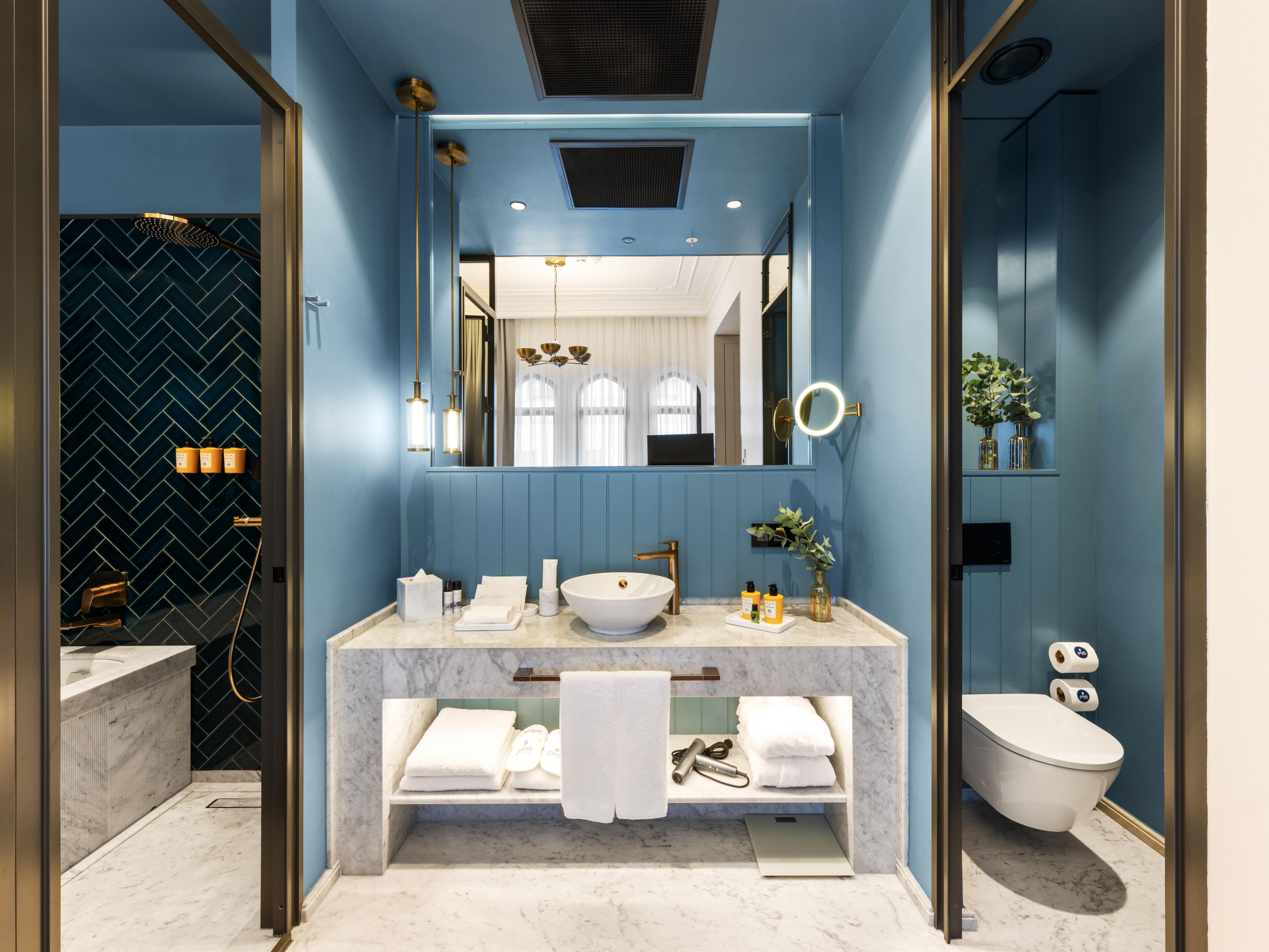 Your suite opens onto a marble ensuite with premium amenities