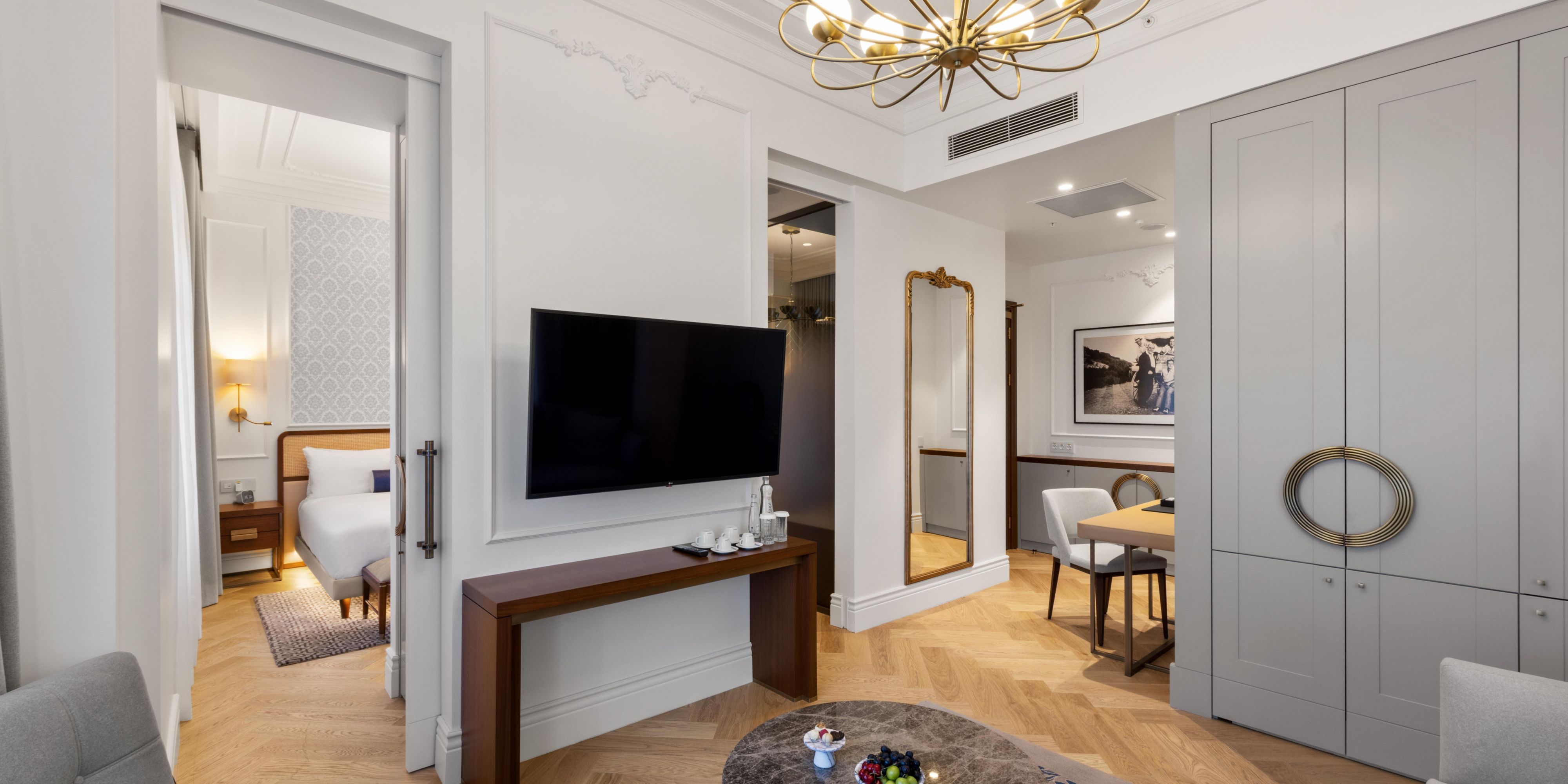 Settle into suite living with a full-length mirror, sofas and more