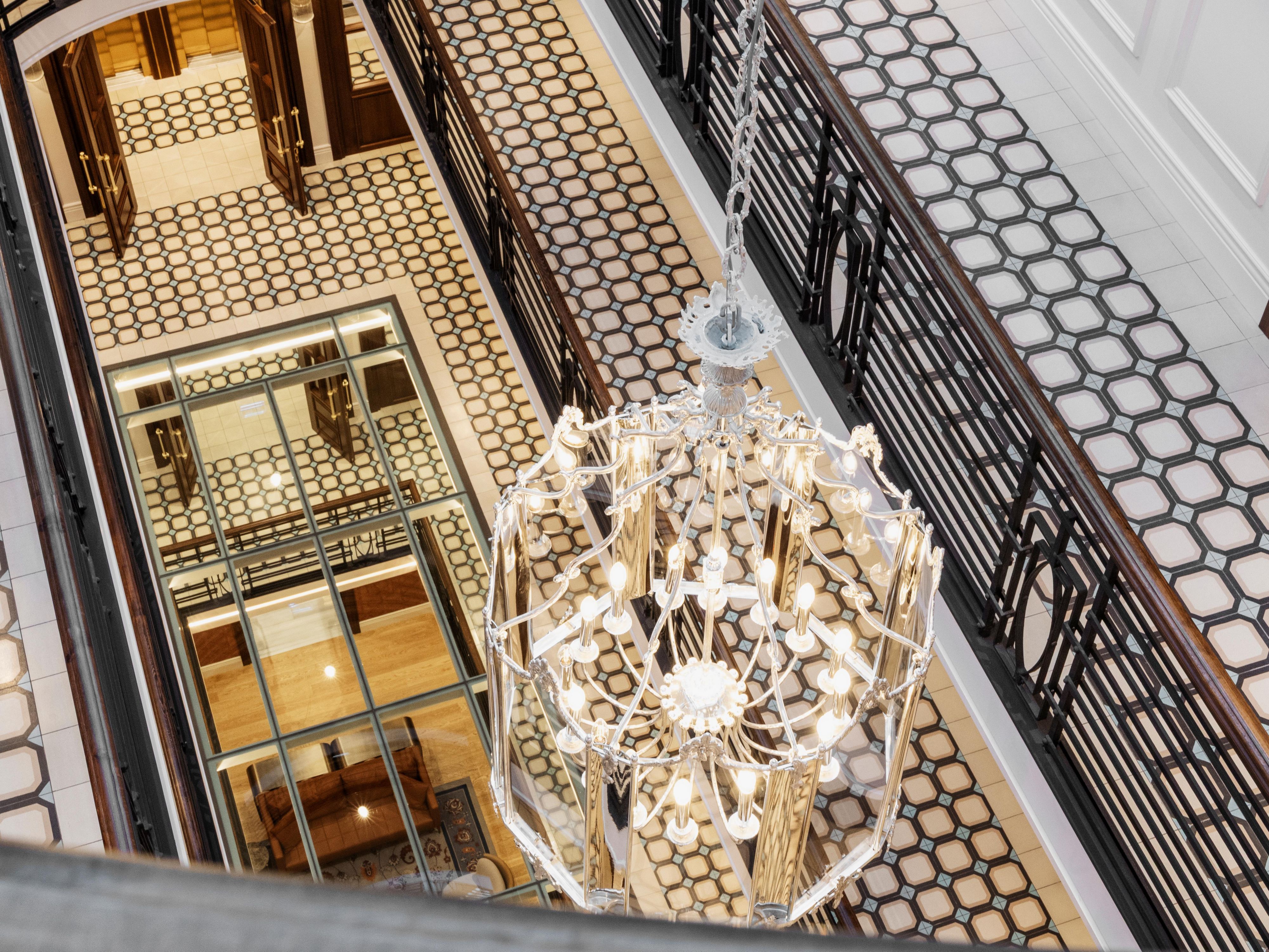 Look down and discover the details woven through our atrium