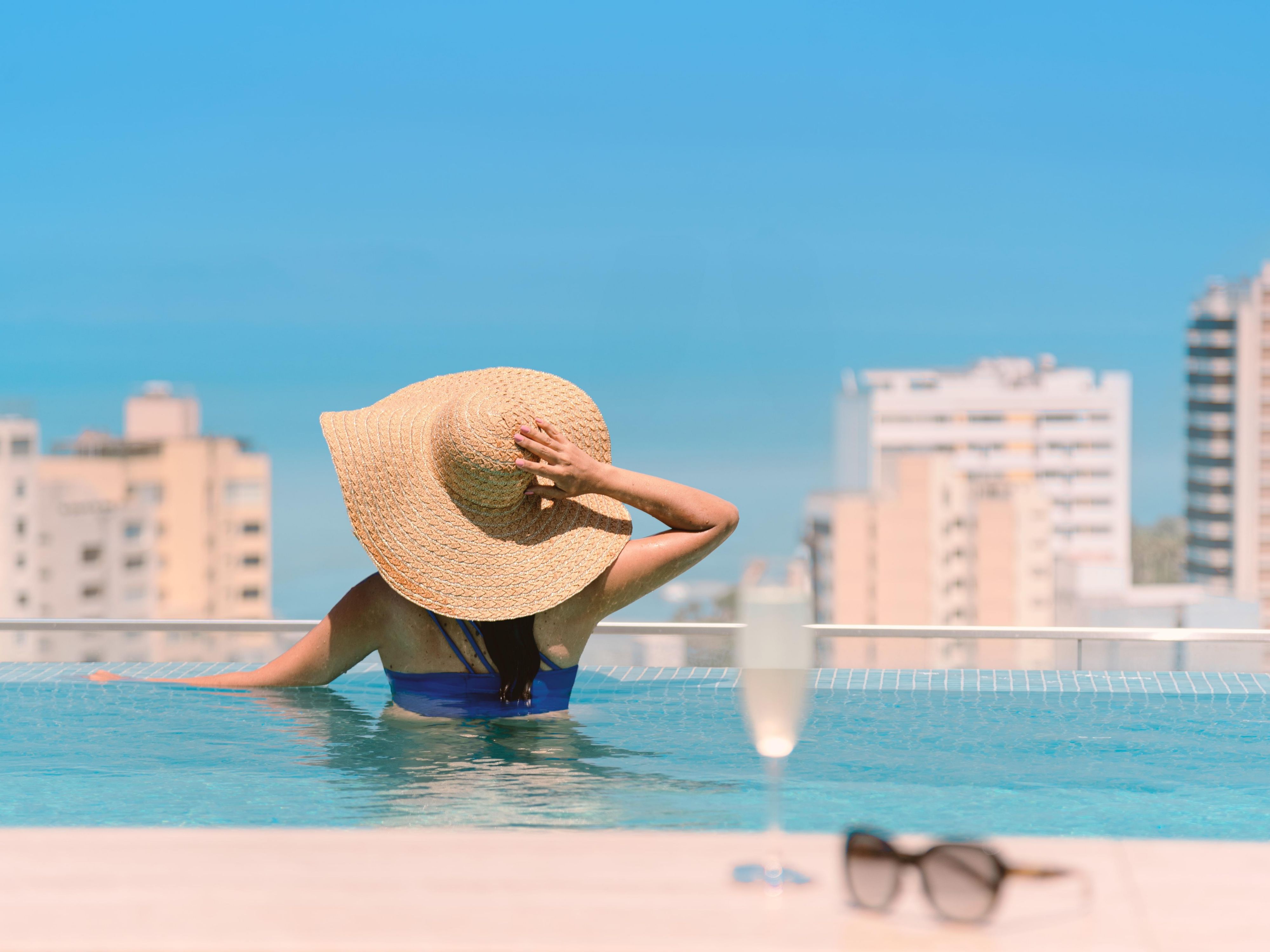 woman in rooftop pool