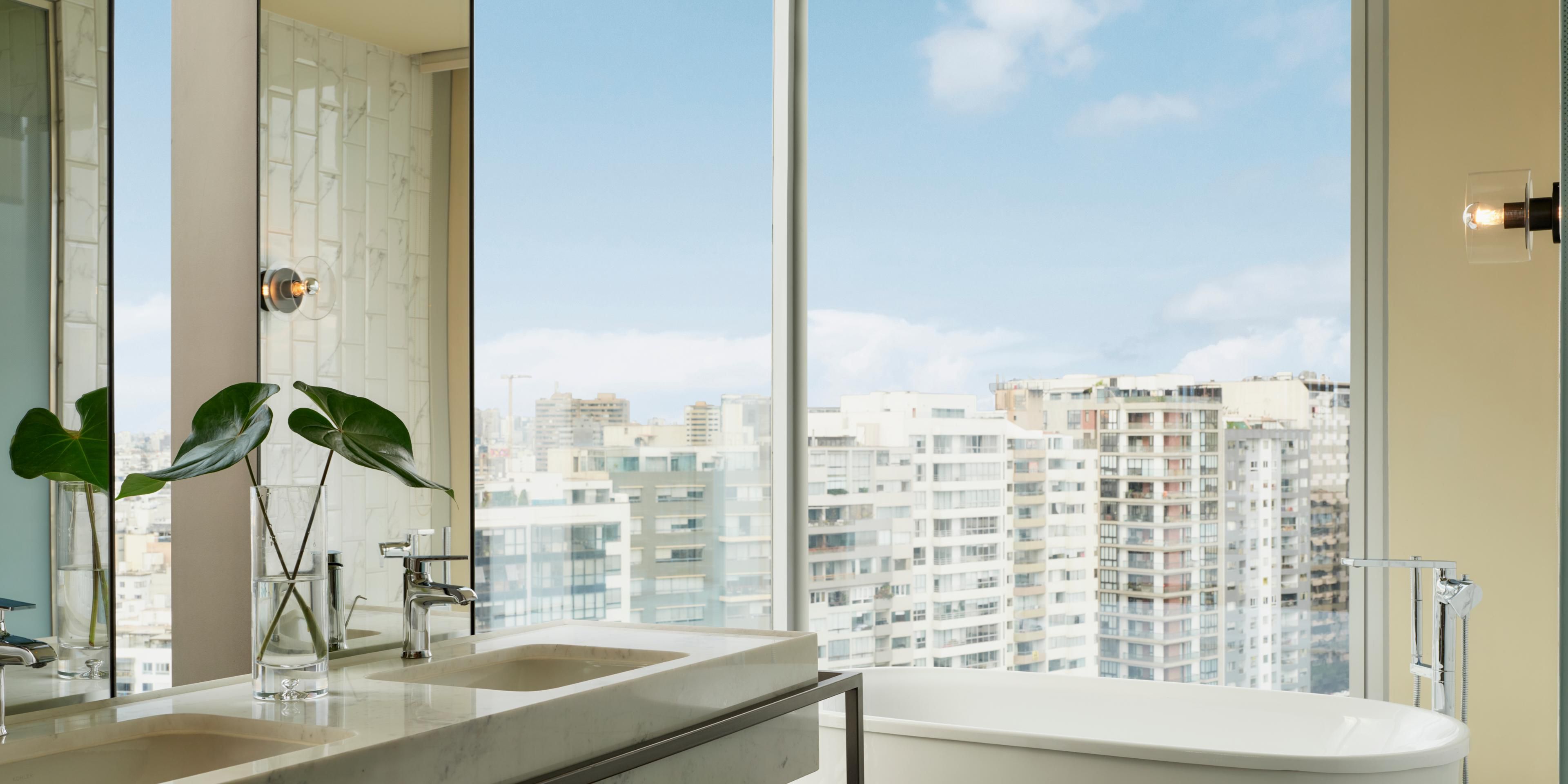 Unwind in the Souma Suite’s lux bathtub with stunning city views.