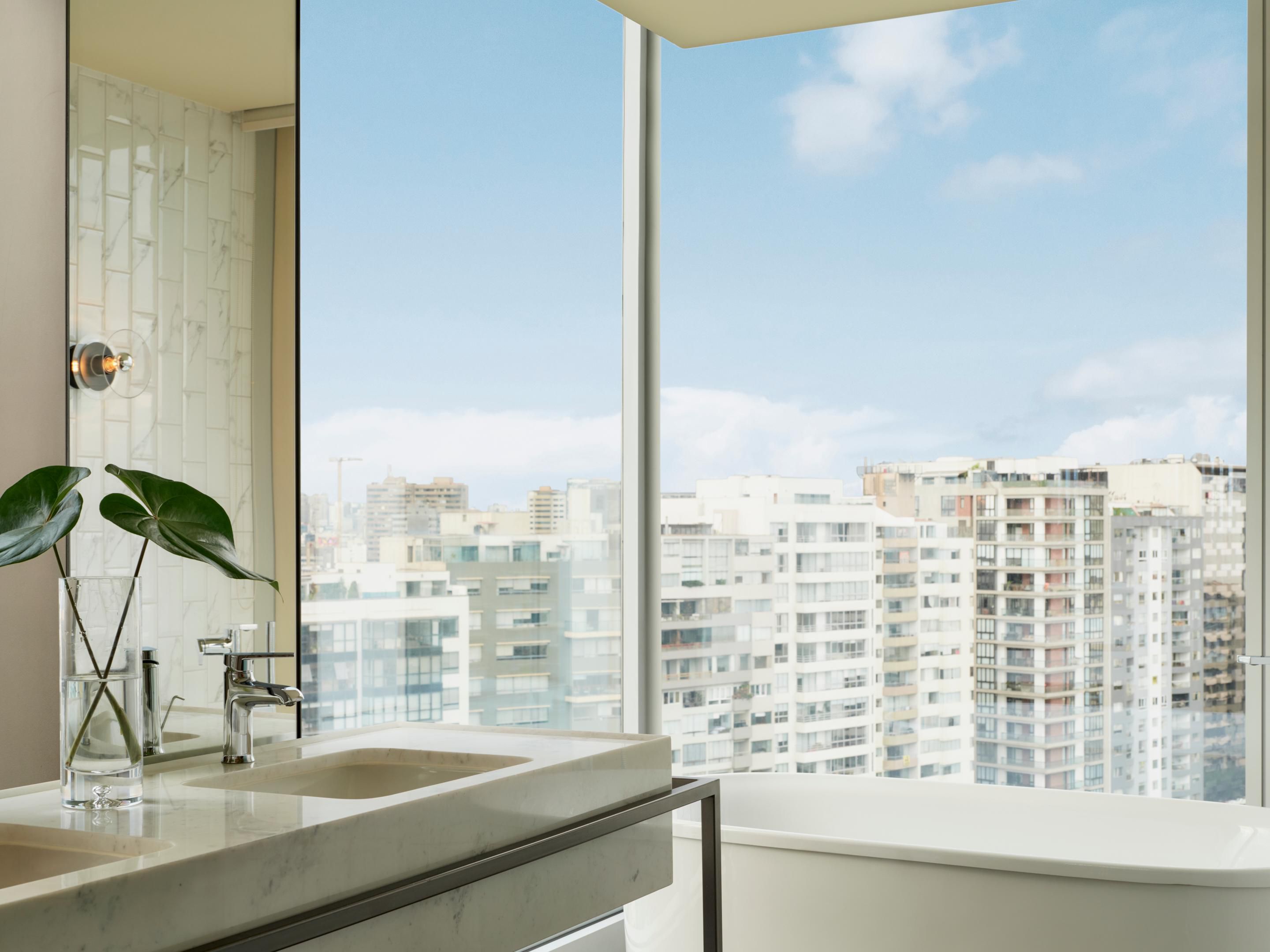 Unwind in the Souma Suite’s lux bathtub with stunning city views.
