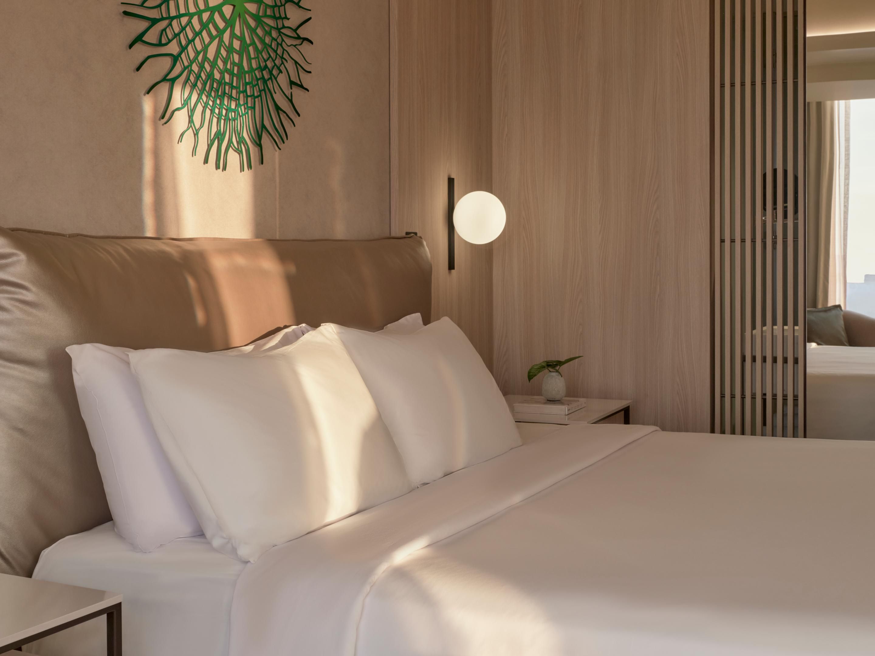 Unwind in a cozy king bed with elegant touches at SOUMA Lima.
