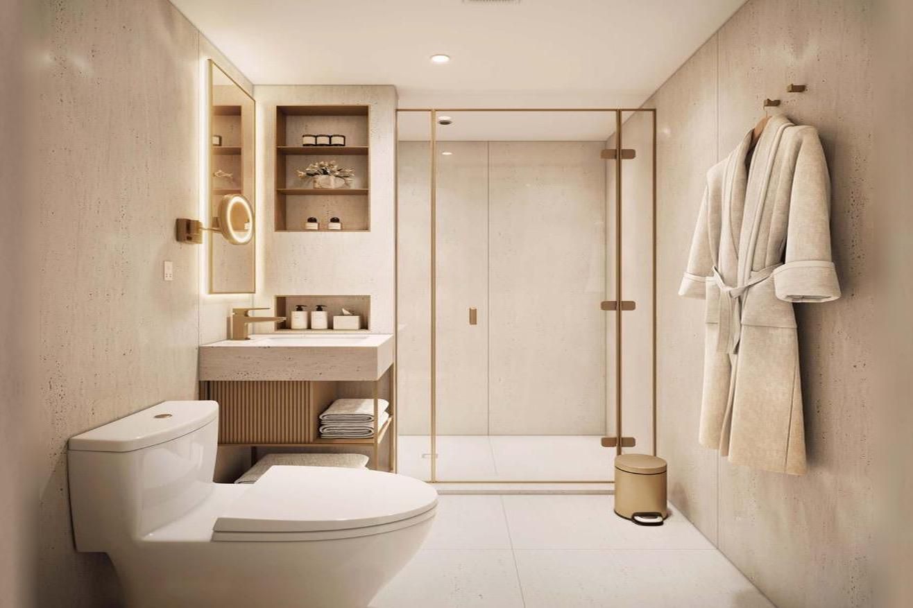 Warm stone, a fluted vanity, and soft backlight in a calm bath.