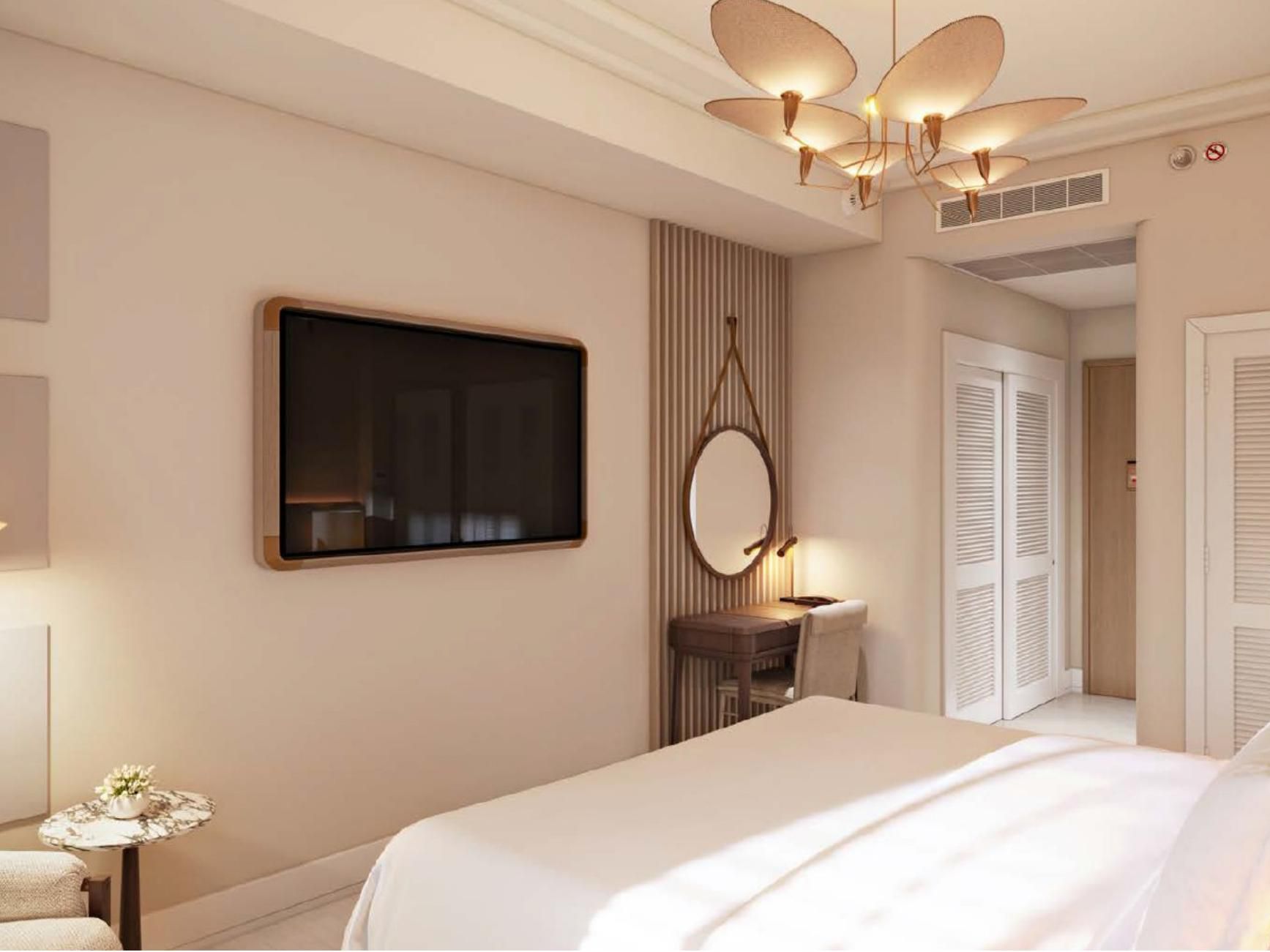Stay in our king room, where a plush bed meets warm brass light.