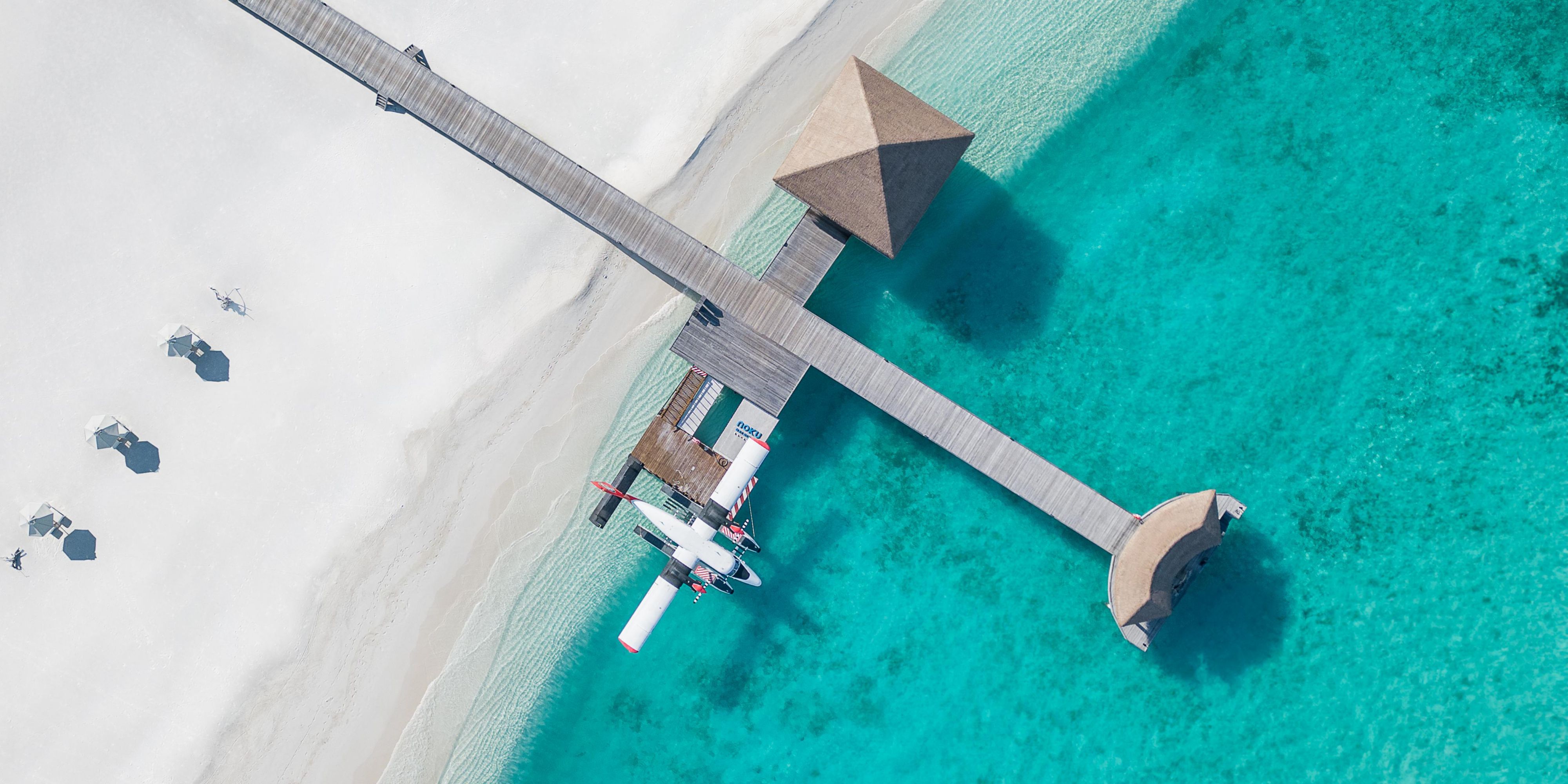 Noku Maldives is in the secluded Noonu Atoll, a scenic 45-minute seaplane from Velana International Airport. Shared transfers are arranged directly through the resort. From take-off, the journey becomes part of the experience—flying over coral-fringed islands towards your peaceful retreat. 