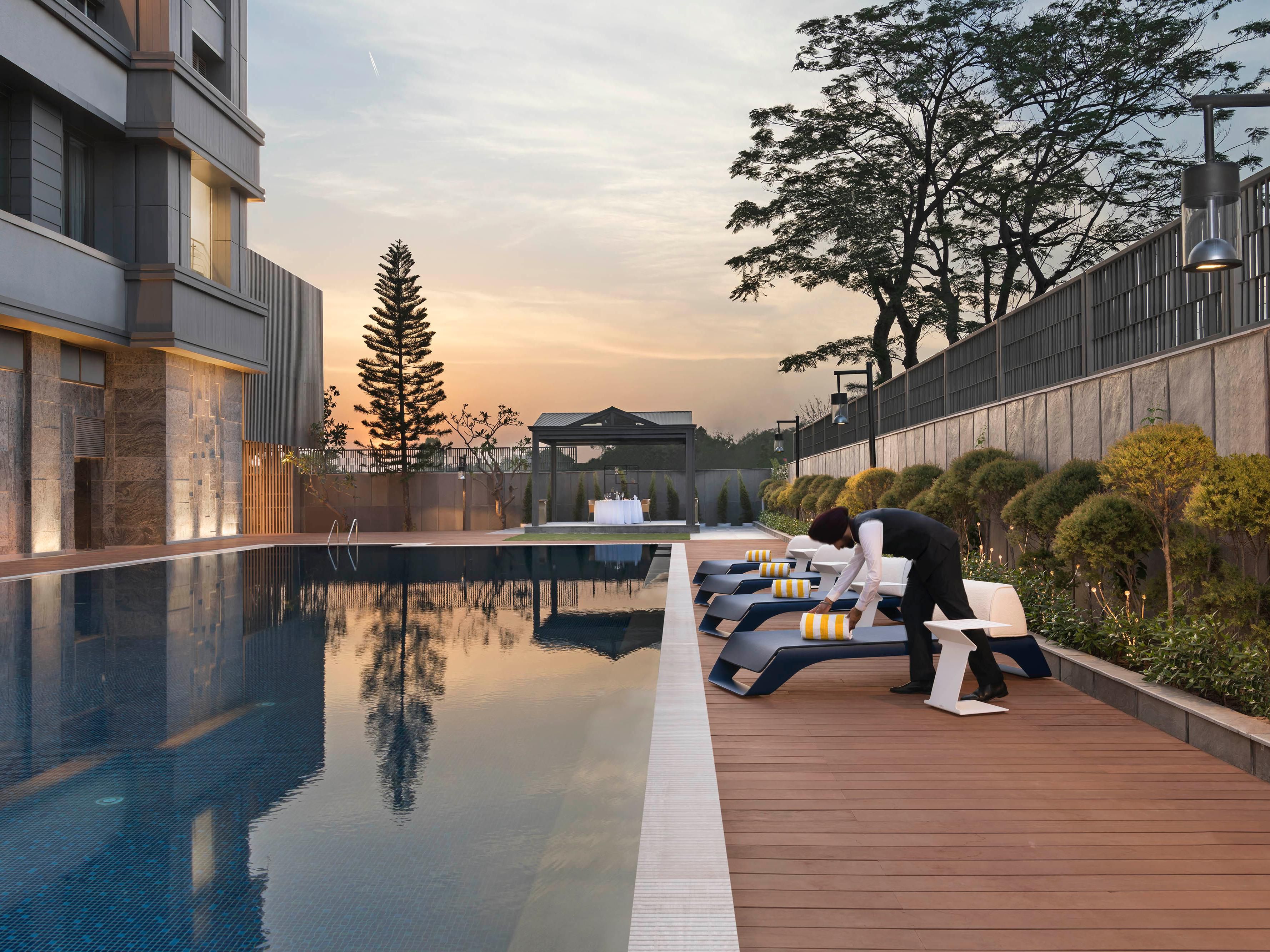 Float beneath the open skies in our serene swimming pool
