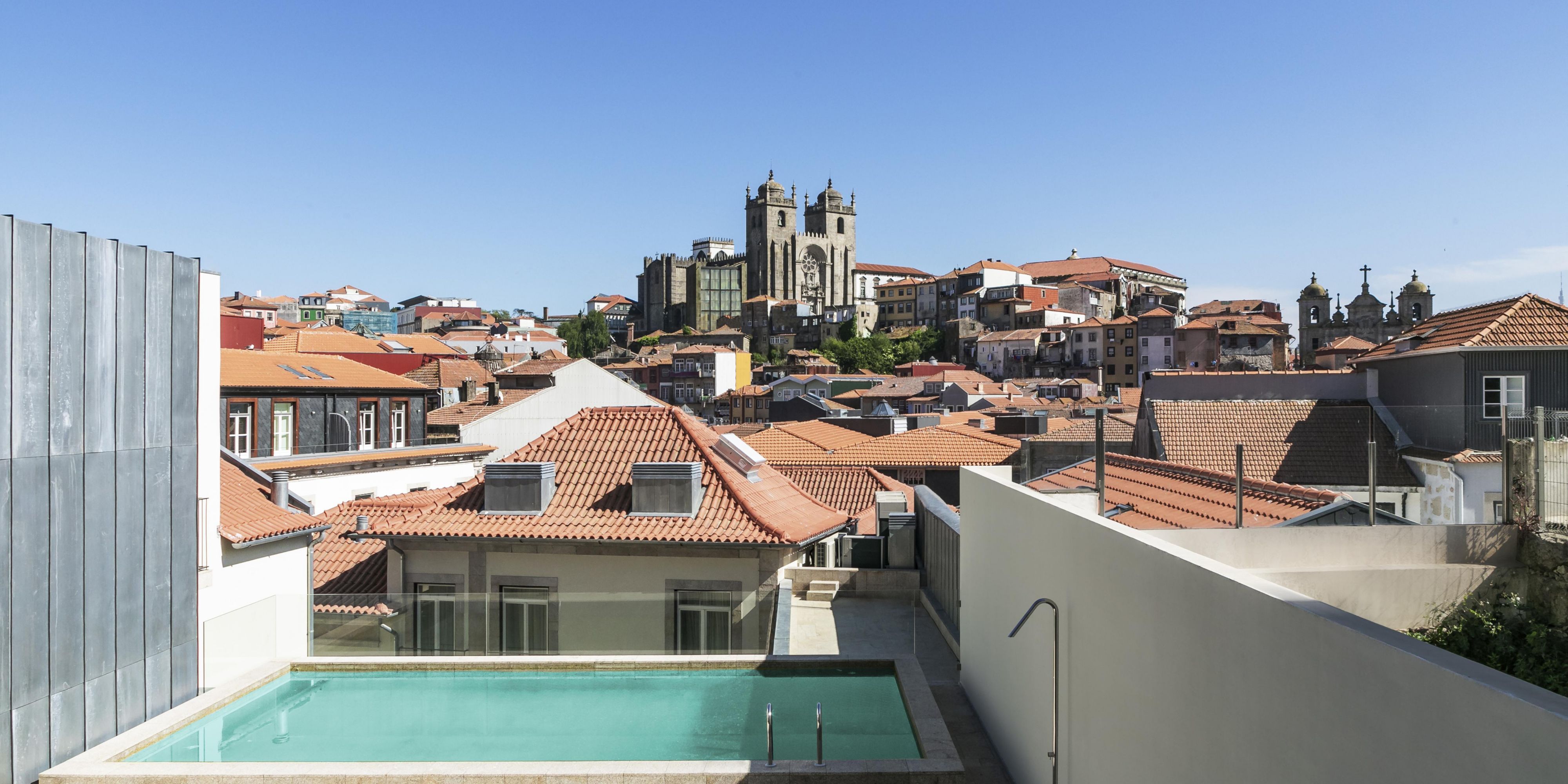 Soak up the beauty of Porto from our rooftop outdoor pool, offering breathtaking panoramic views of the cathedral and historic skyline. Unwind in a serene setting with plush sun loungers and enjoy a refreshing swim high above the city’s bustling streets.
