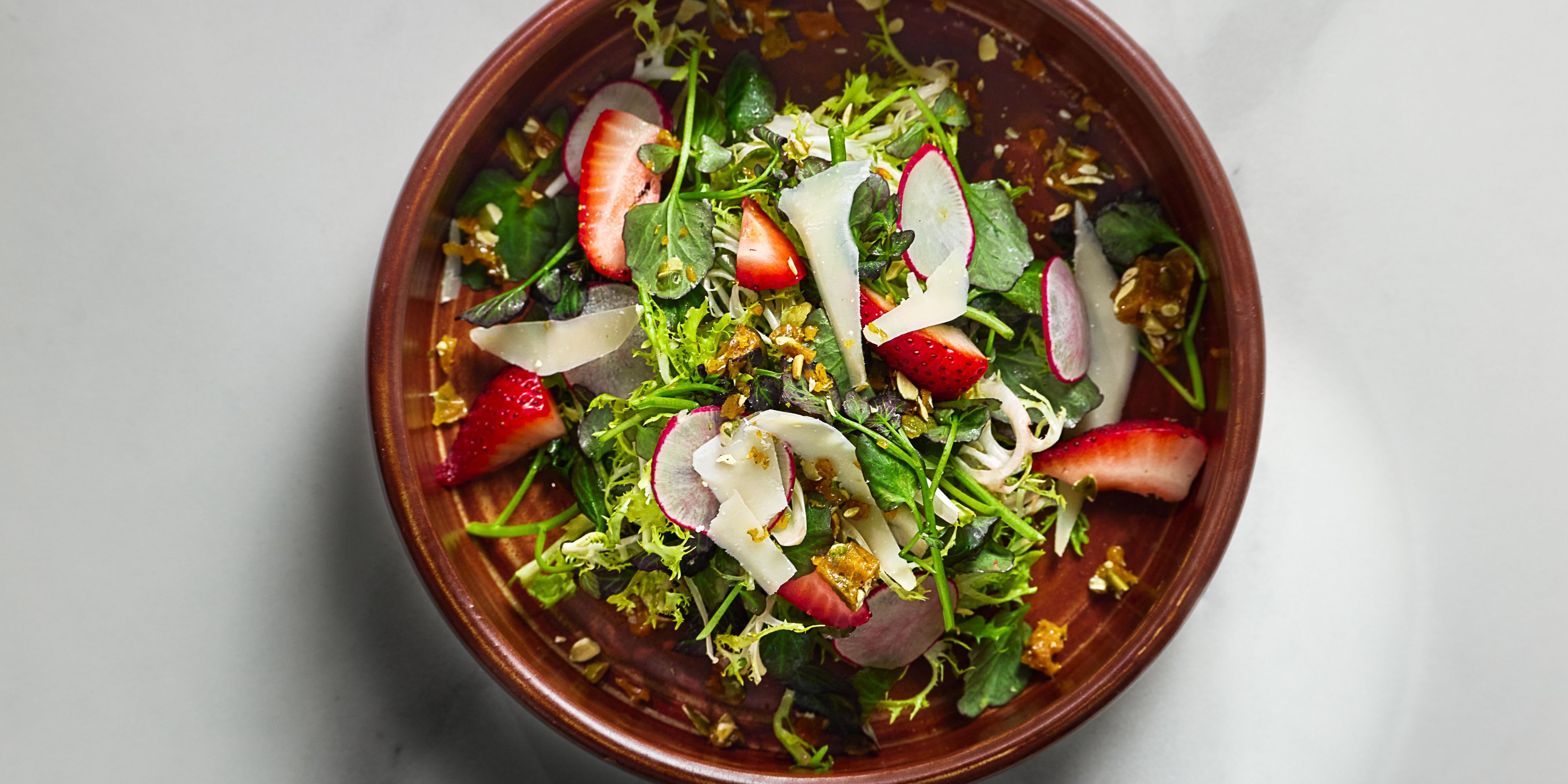 Summer salad featuring greens and strawberries