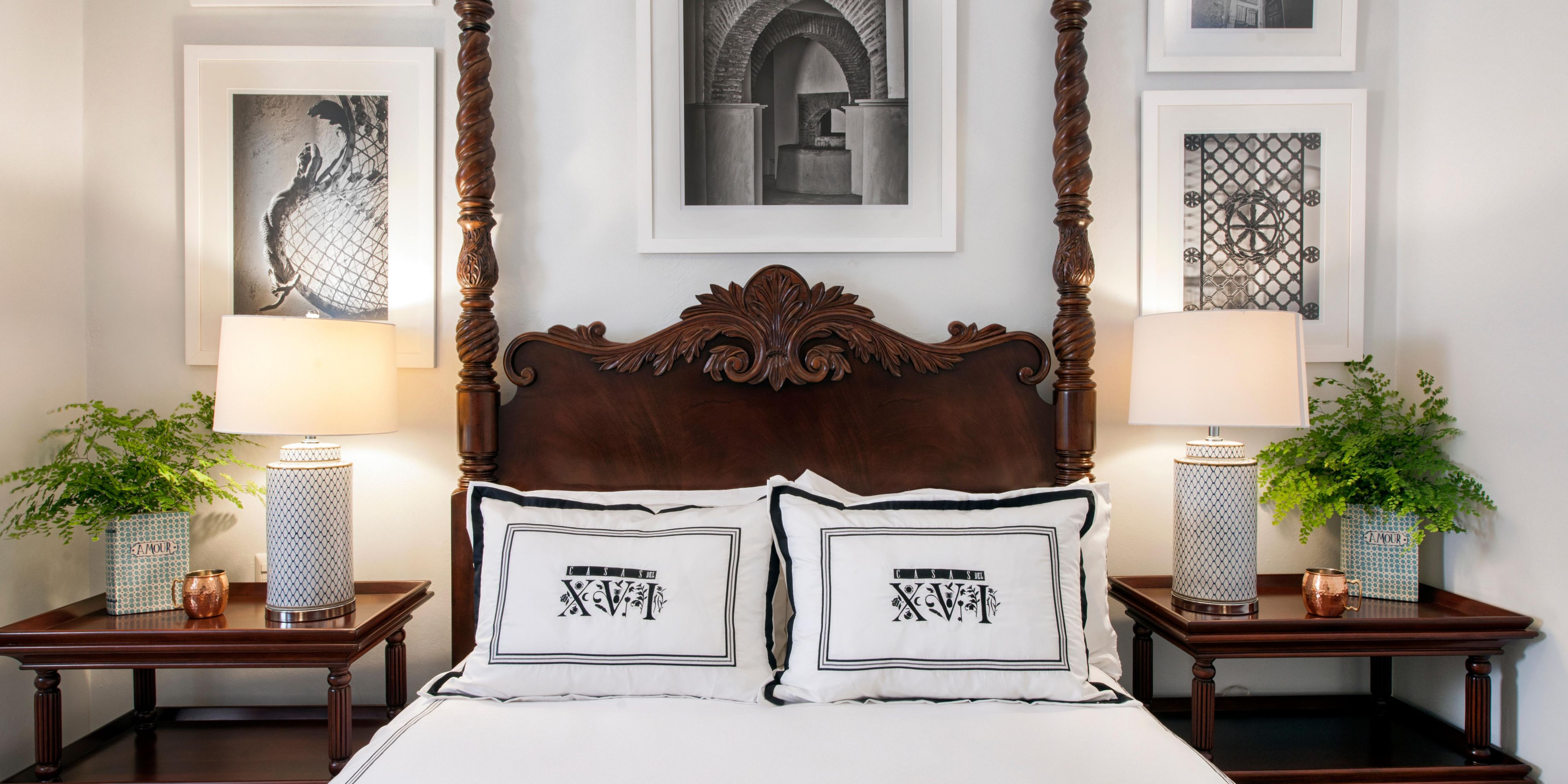 Elegant room with classic bed and symmetrical decor.