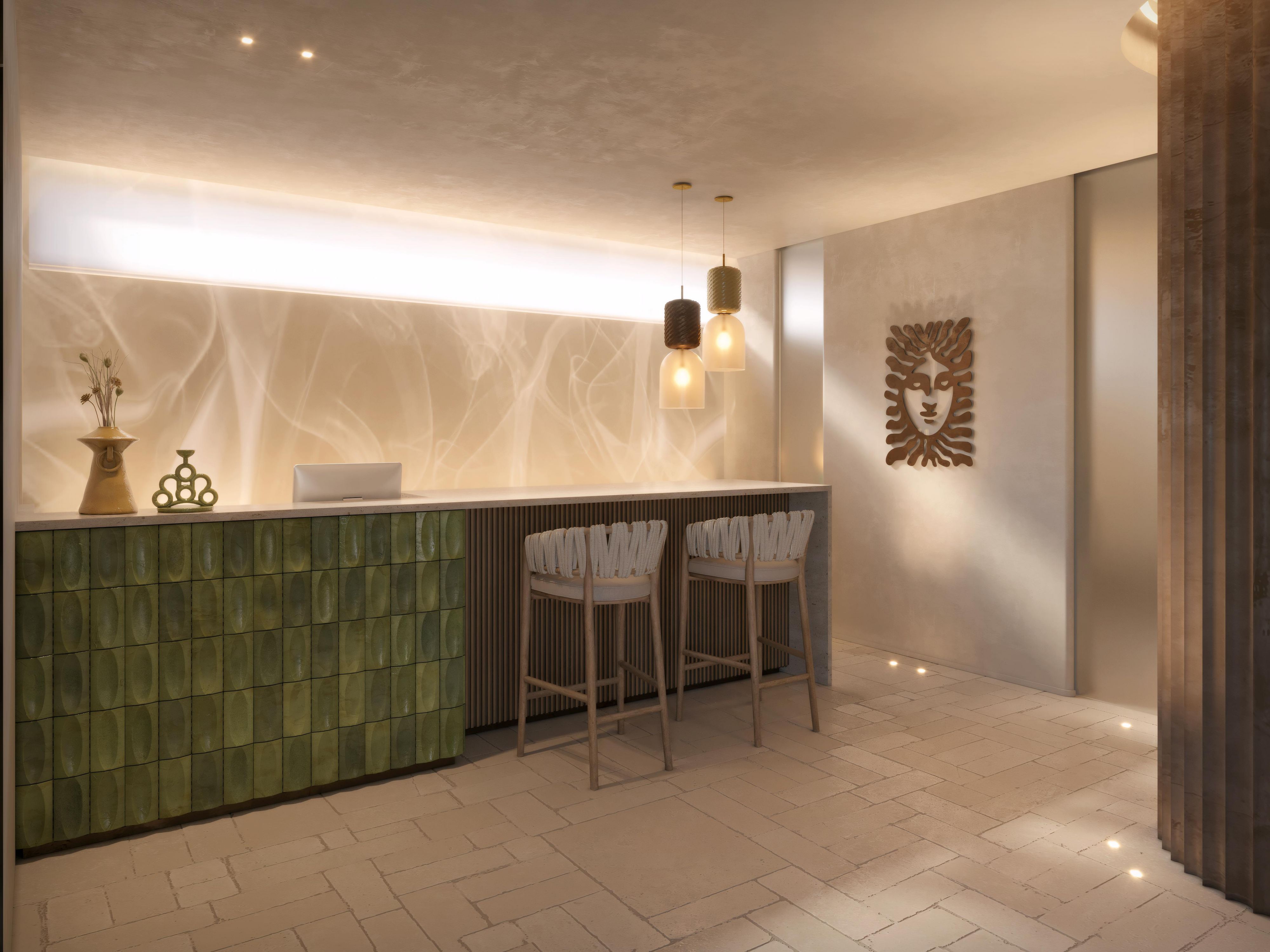 Spa reception with green tiled counter and soft ambient light