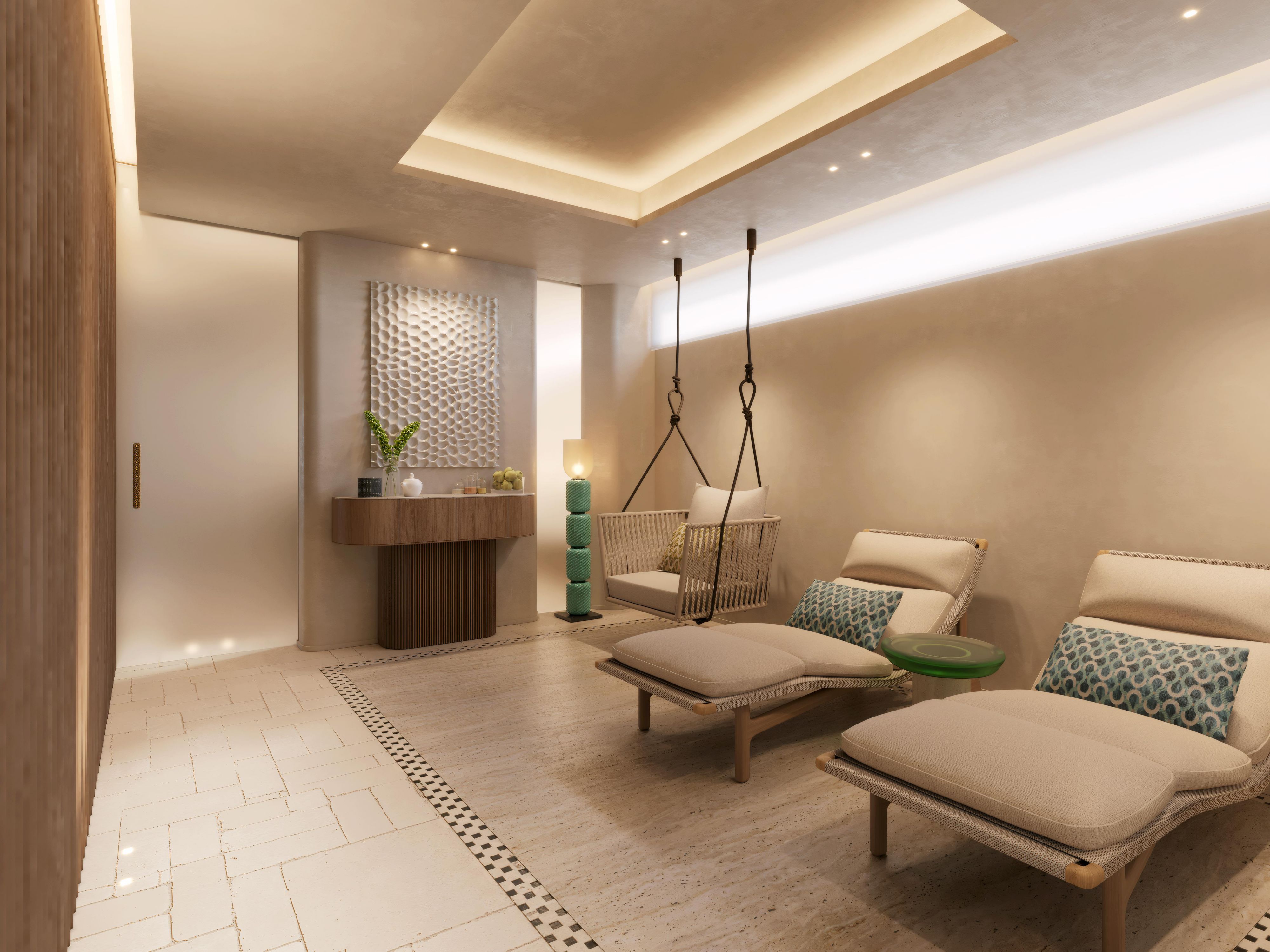 Spa relaxation room with sun loungers and warm recessed lighting