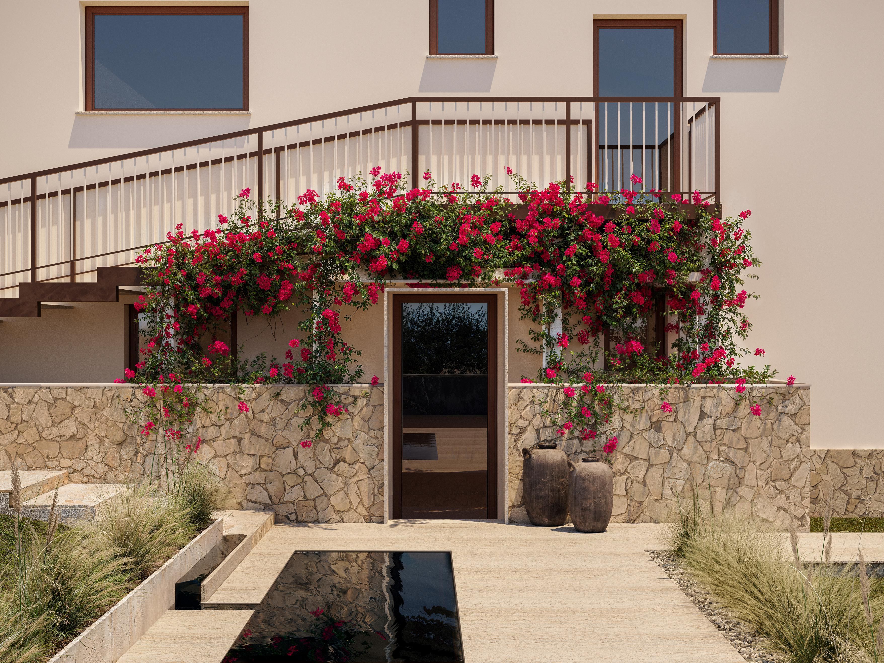 Spa entrance with stone facade and flowering bougainvillea