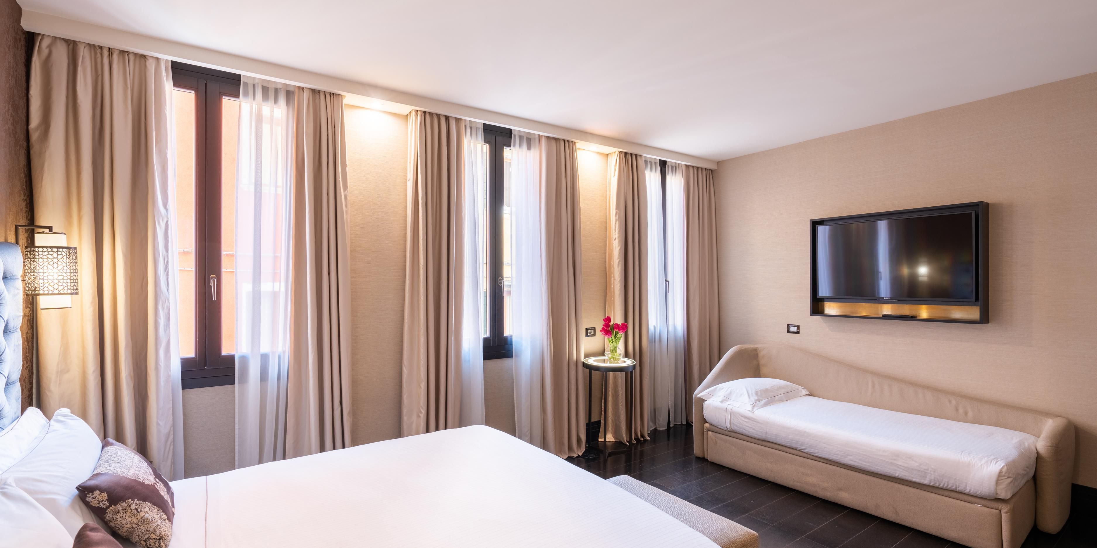 One King Standard room with two single sofas for comfort